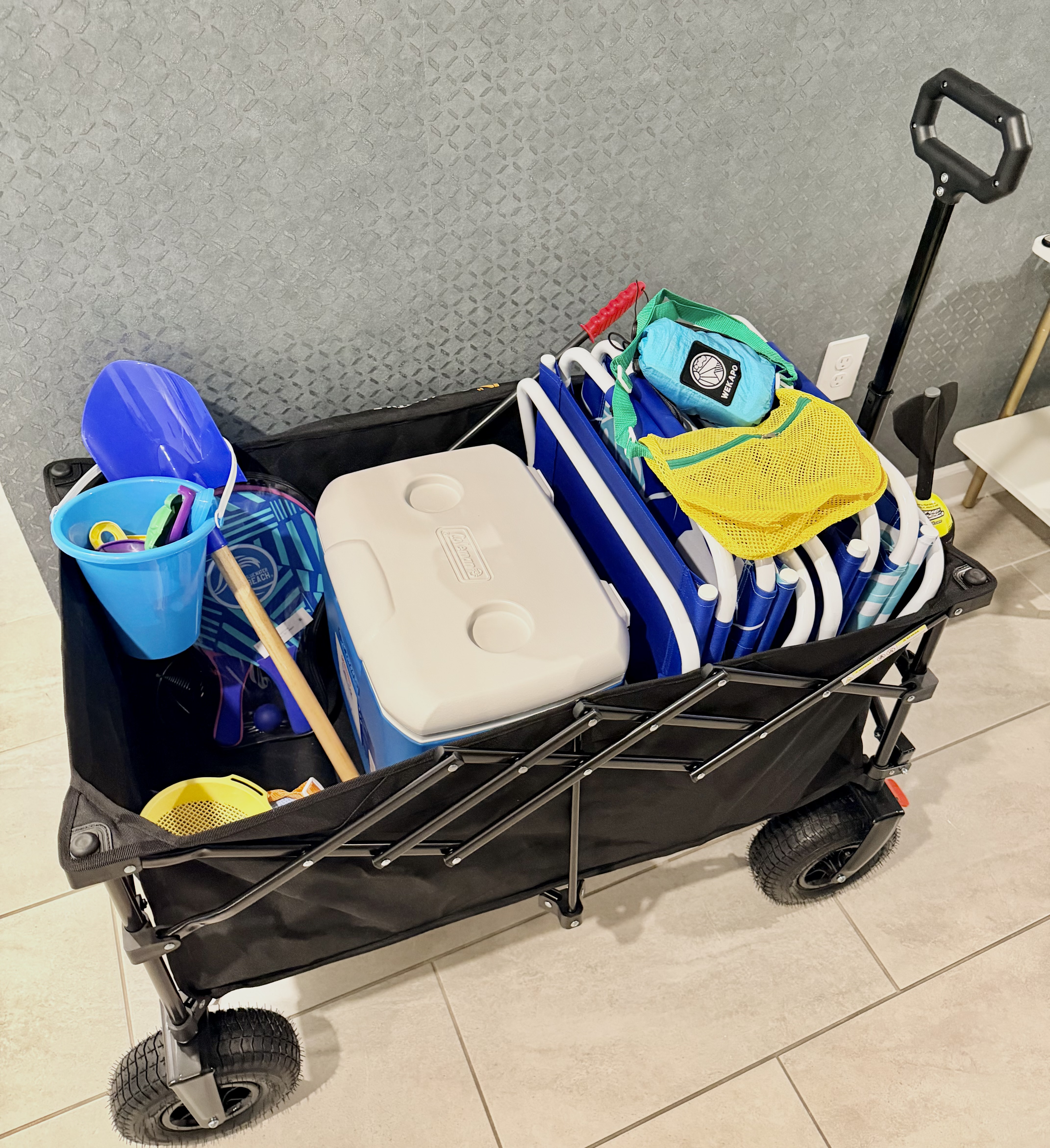 Beach-ready wagon stocked with chairs, cooler, and family-friendly gear