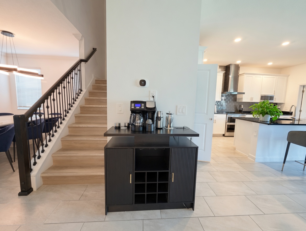 Bright open-concept home with modern kitchen and guest coffee bar