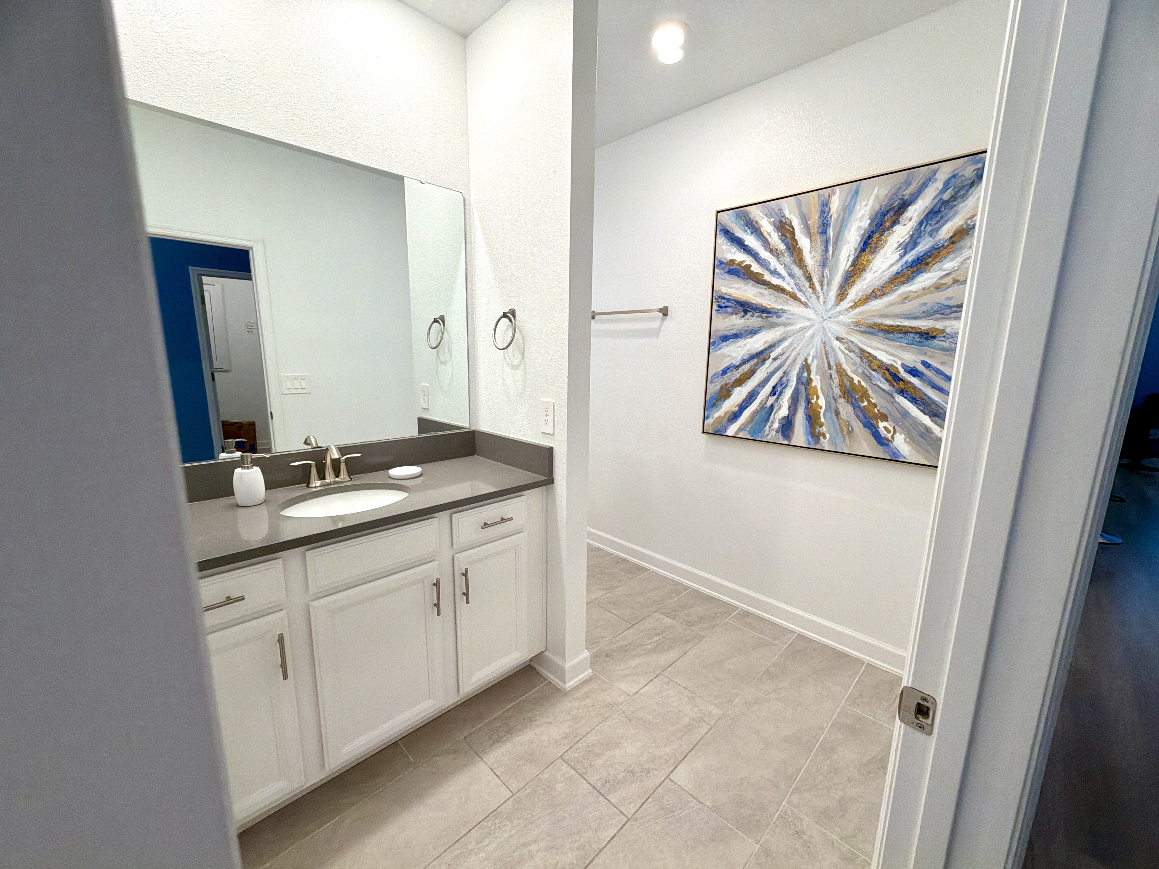 Bright modern bathroom with stylish artwork and a spacious feel