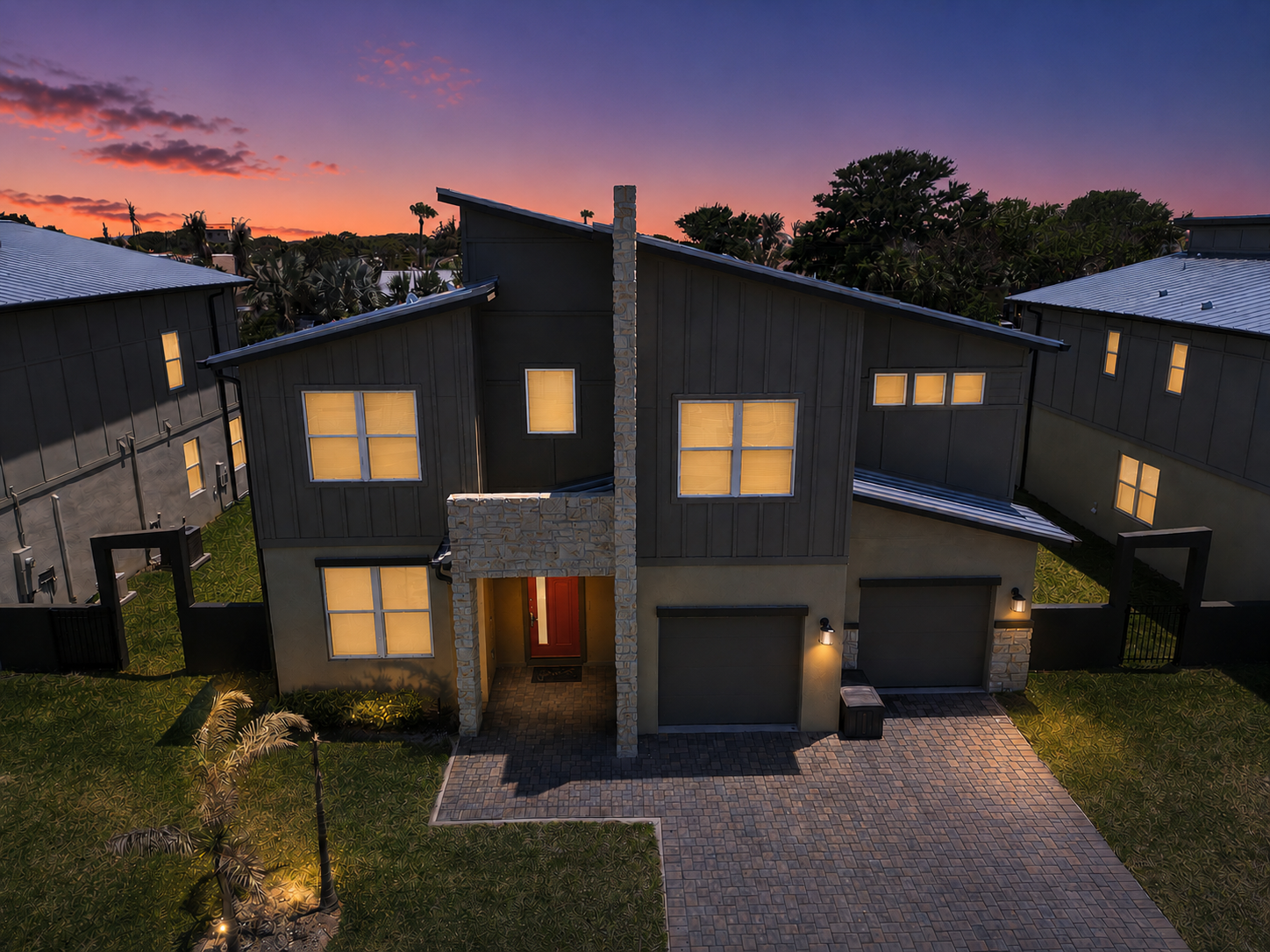 Modern twilight exterior with bold architecture and inviting curb appeal