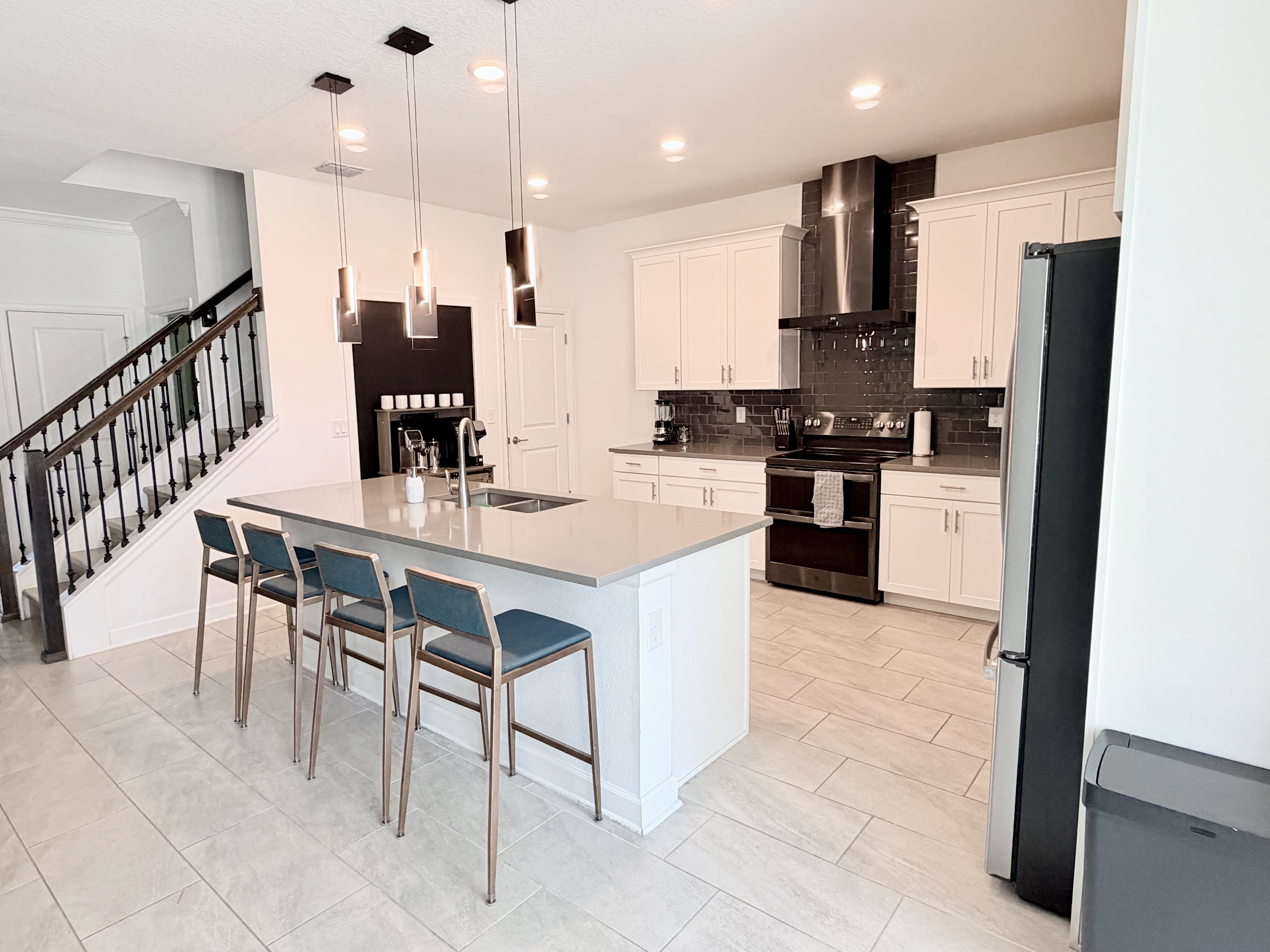 Bright modern kitchen with large island seating for four