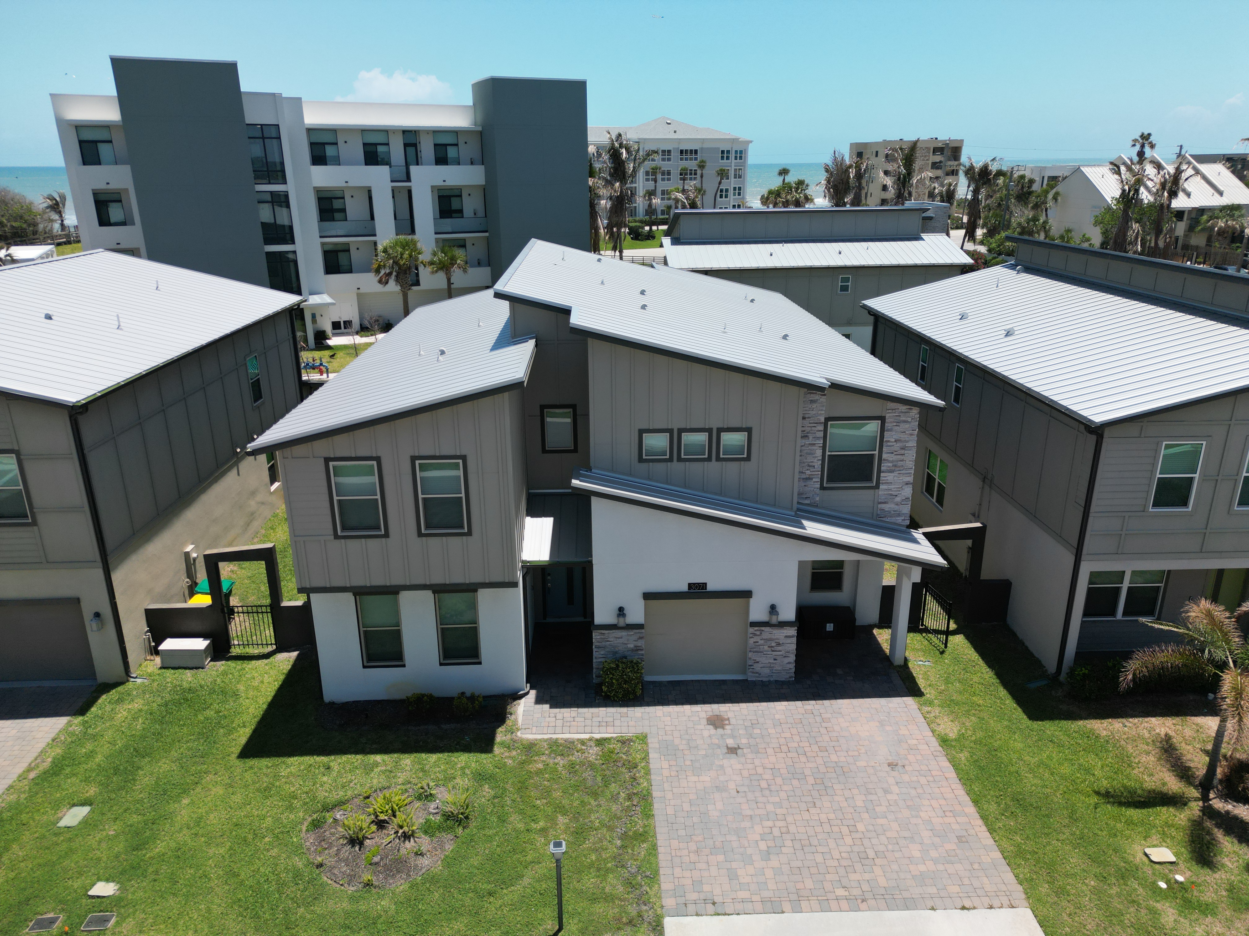 Modern coastal home with ocean views in a prime beachside community