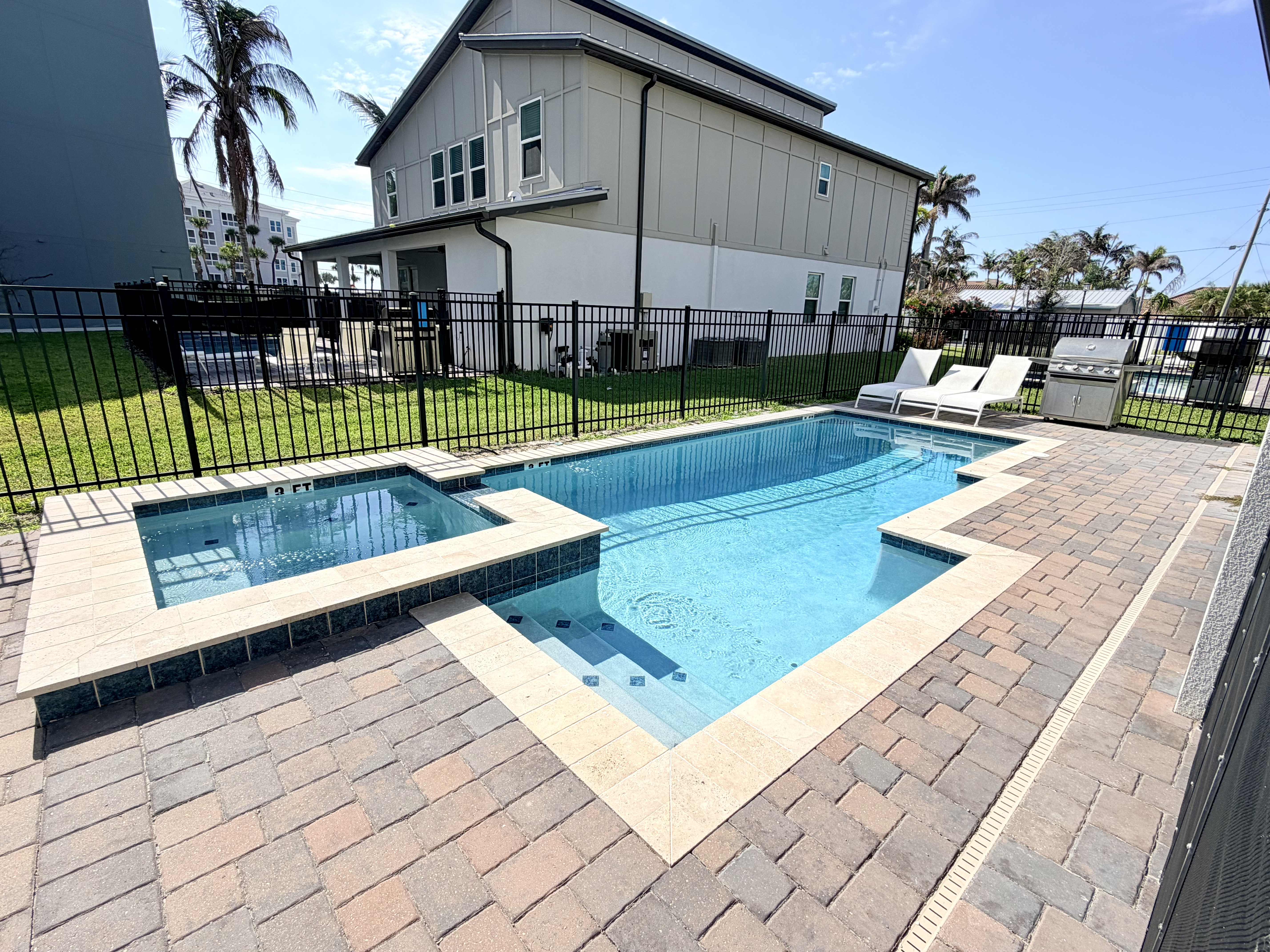 Private pool and spa with sunny lounge deck and outdoor grill