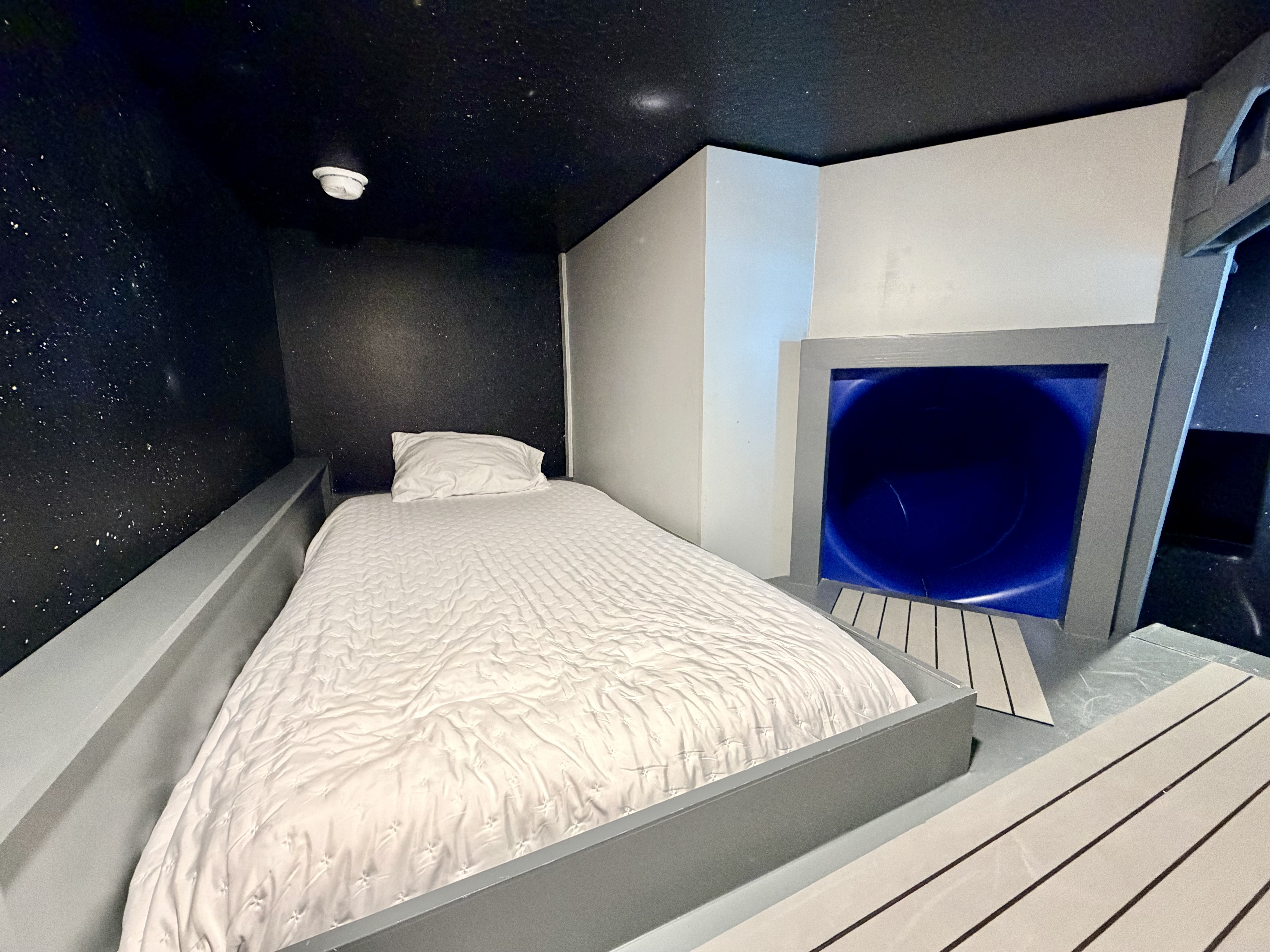Cozy futuristic sleeping nook with bold design accents