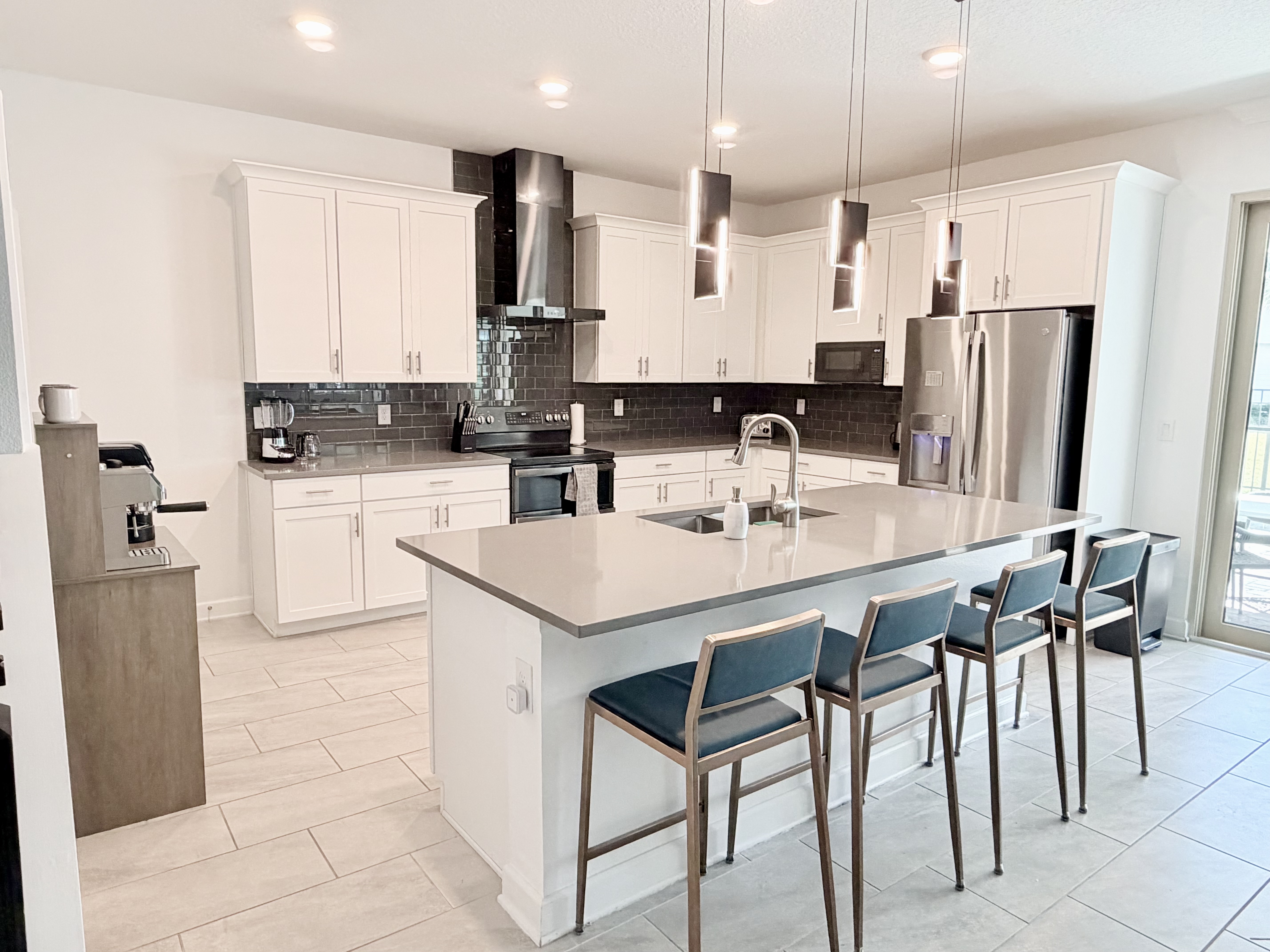 Bright modern kitchen with large island seating for four