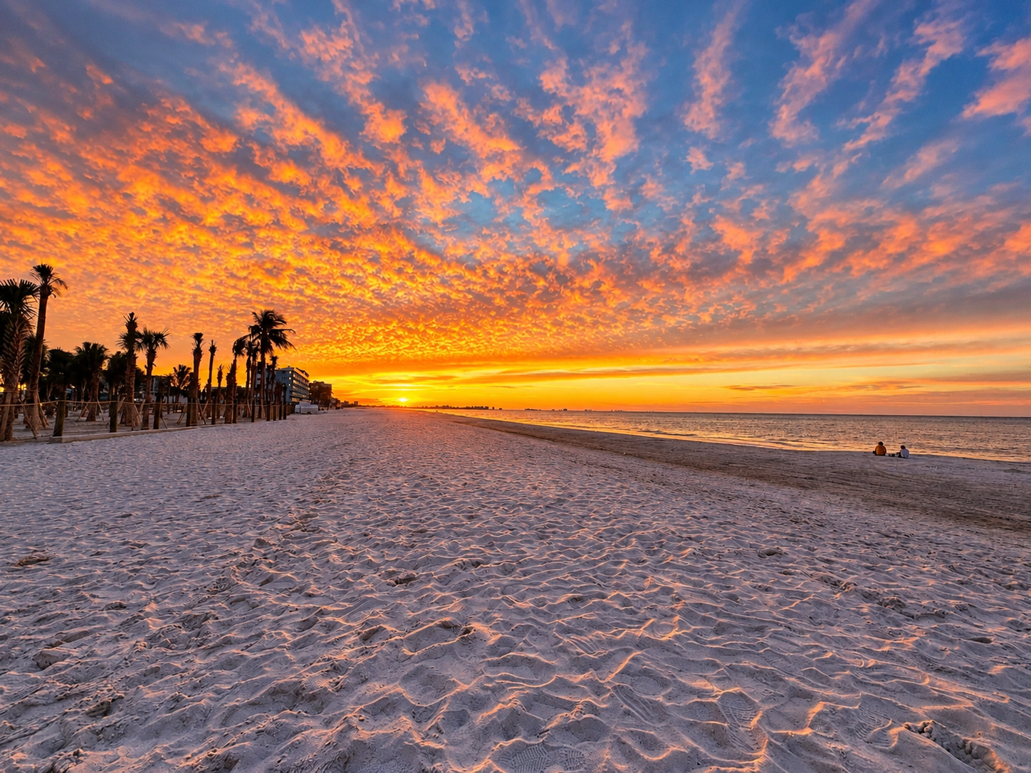Stunning beachfront sunset with wide sandy shores and tranquil ocean views