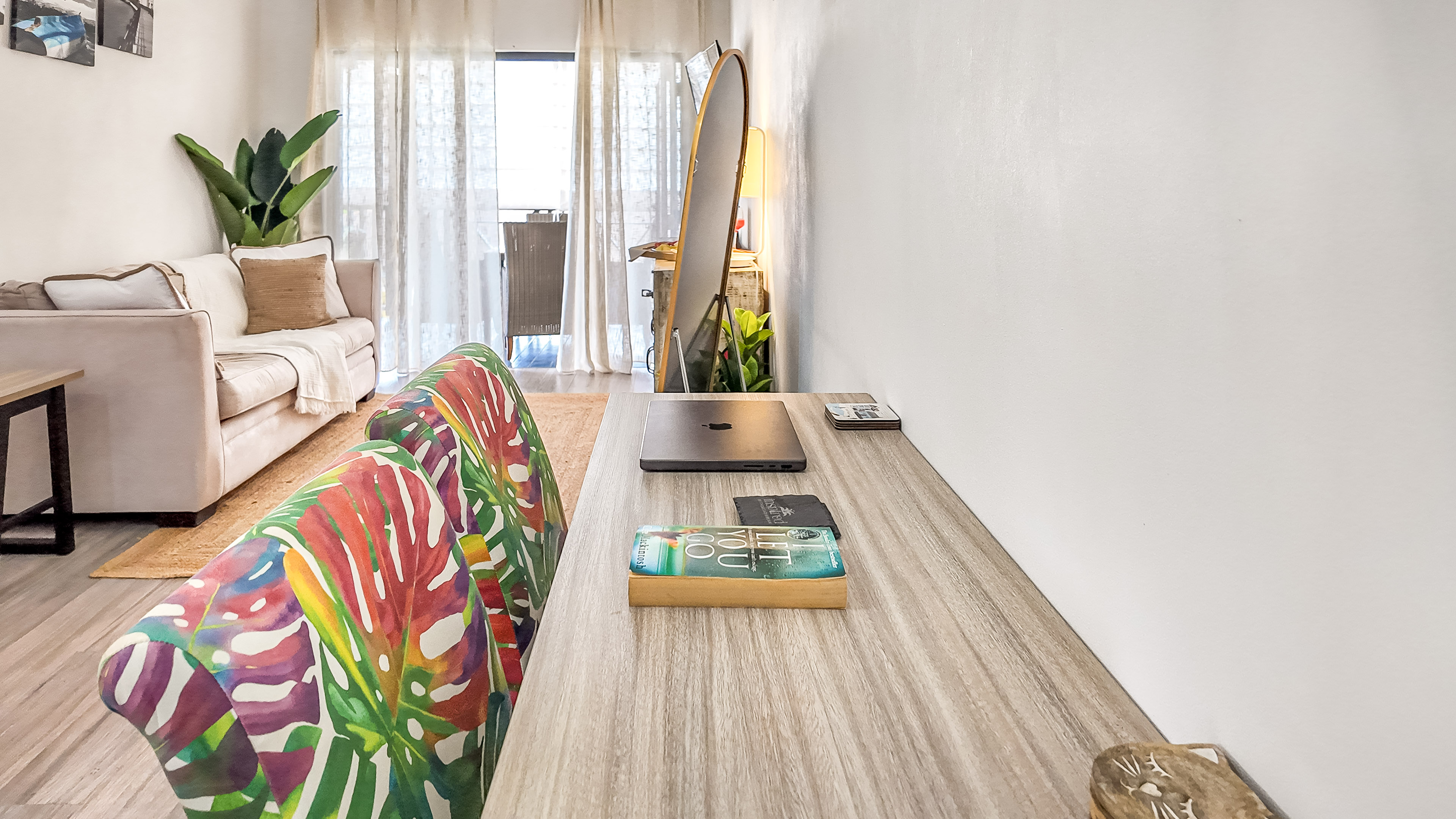 Bright workspace and cozy lounge with natural light and balcony access