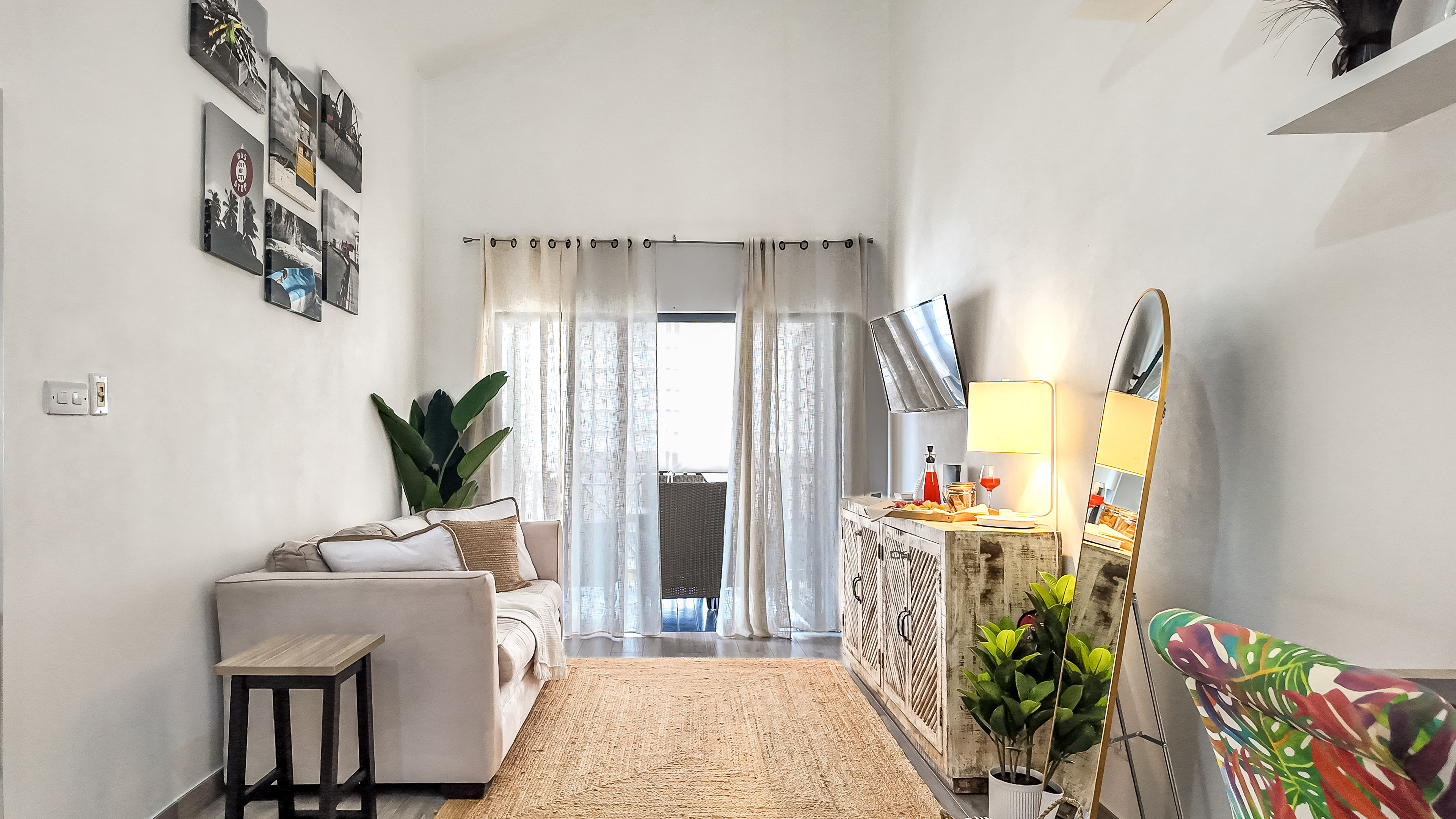 Bright, airy lounge with cozy decor, natural light, and stylish accents