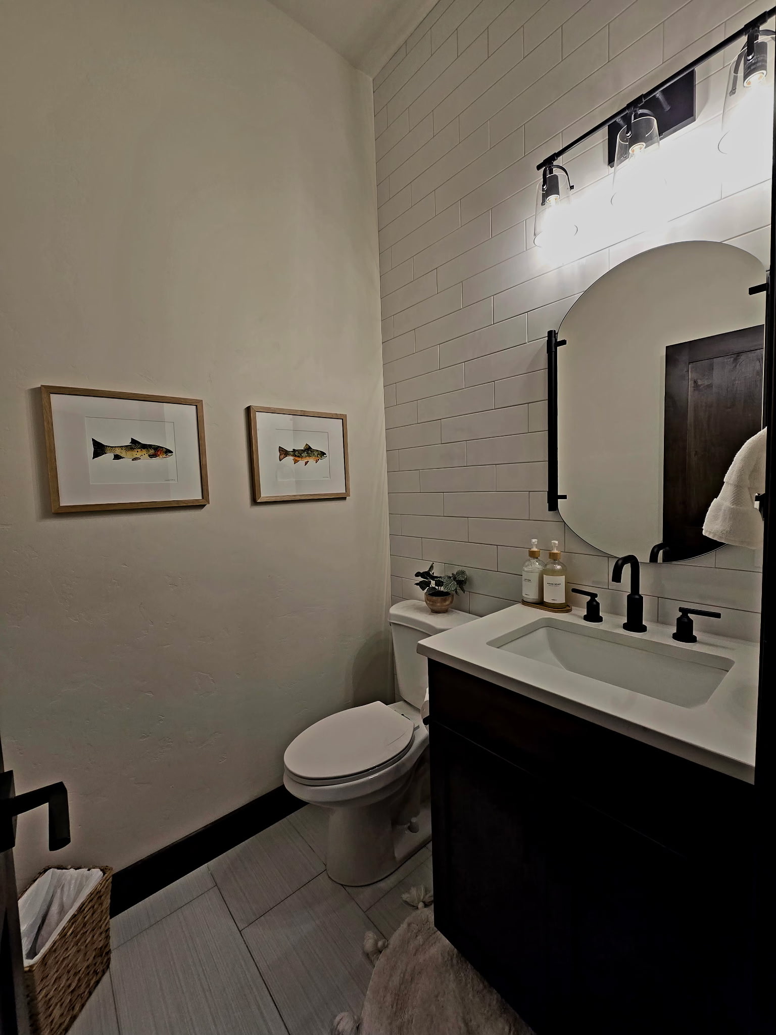 Modern bathroom with sleek black fixtures and bright designer finishes