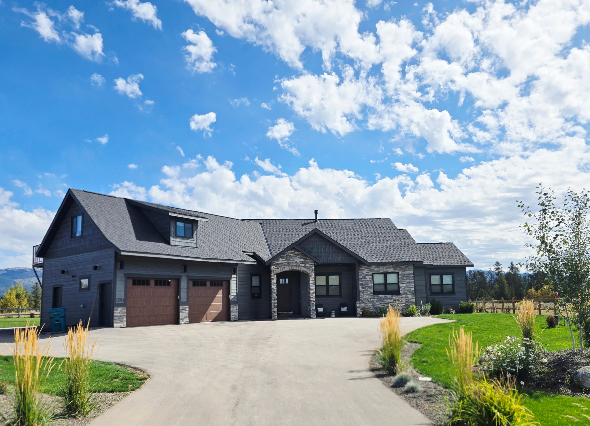 Spacious luxury home with mountain charm, landscaped grounds, and 3-car garage
