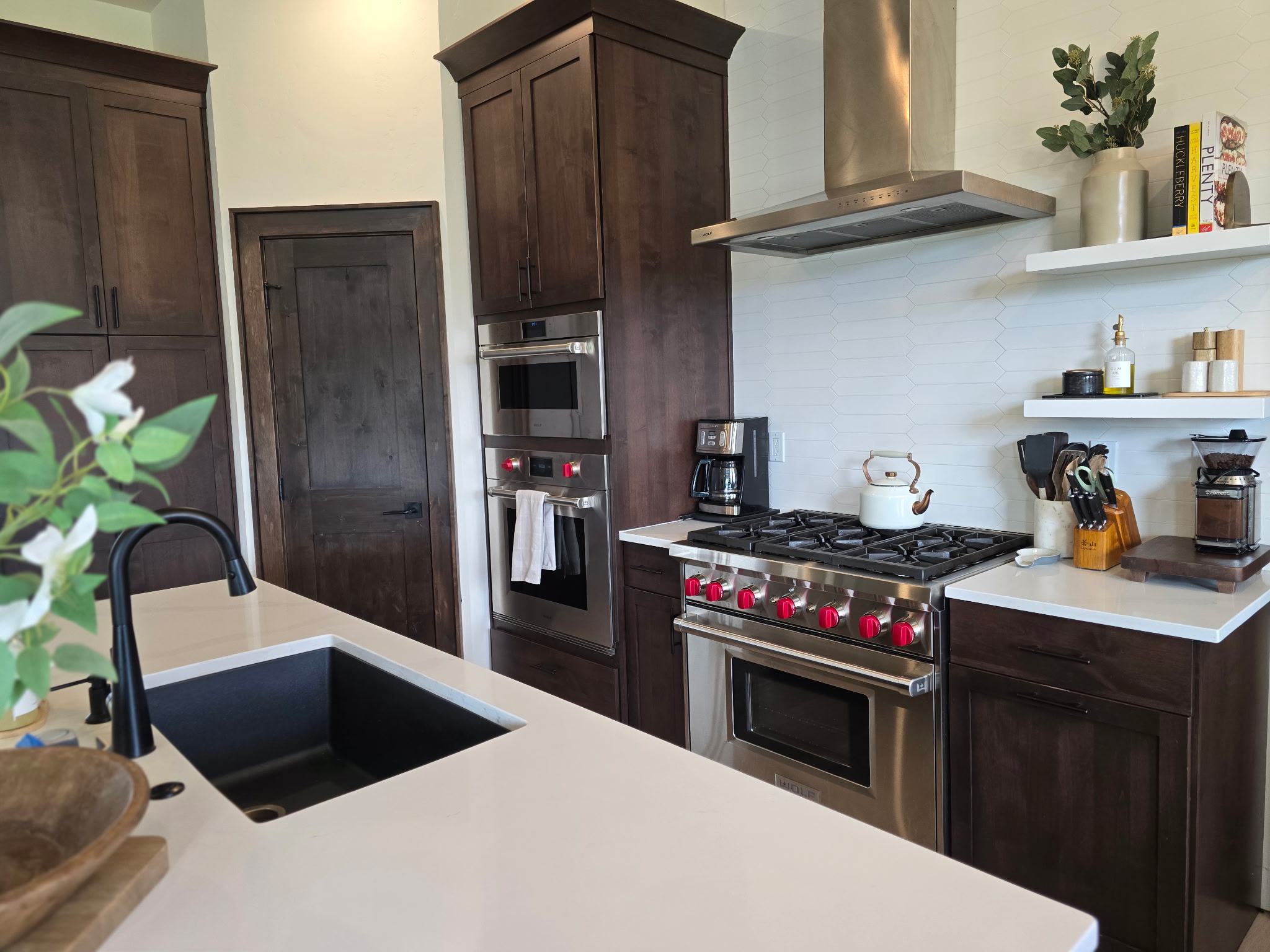 Chef’s kitchen with luxe gas range, double ovens, and spacious island