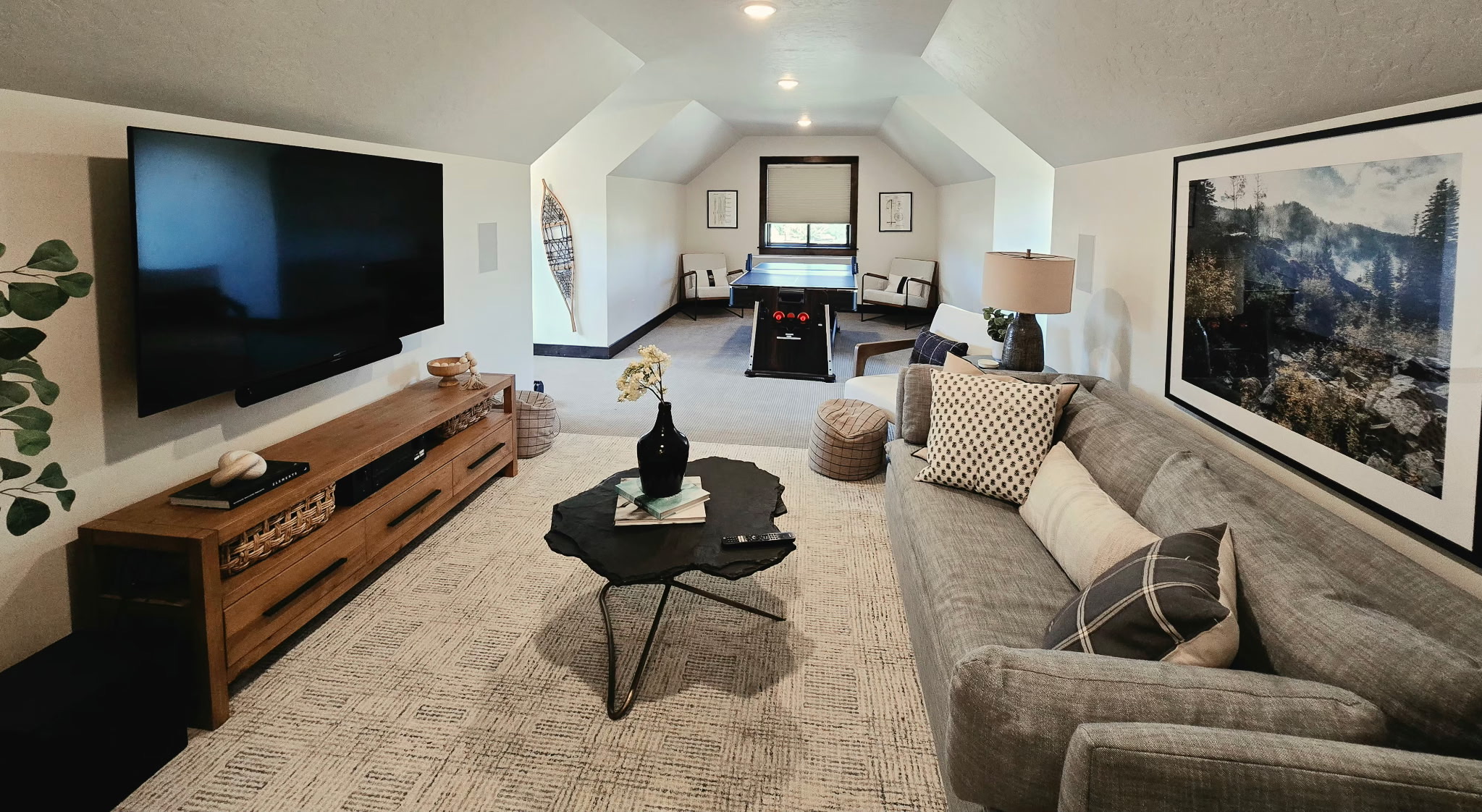 Cozy loft lounge with big-screen TV and game table for added fun