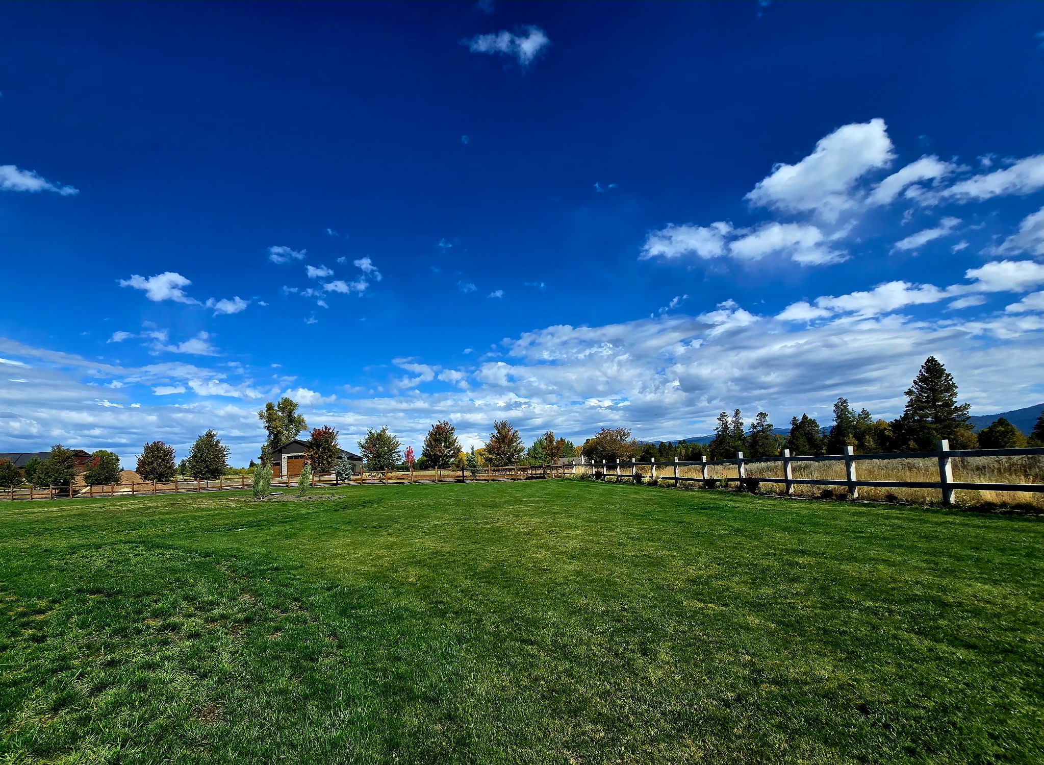 Expansive green lawn with scenic views and peaceful country charm