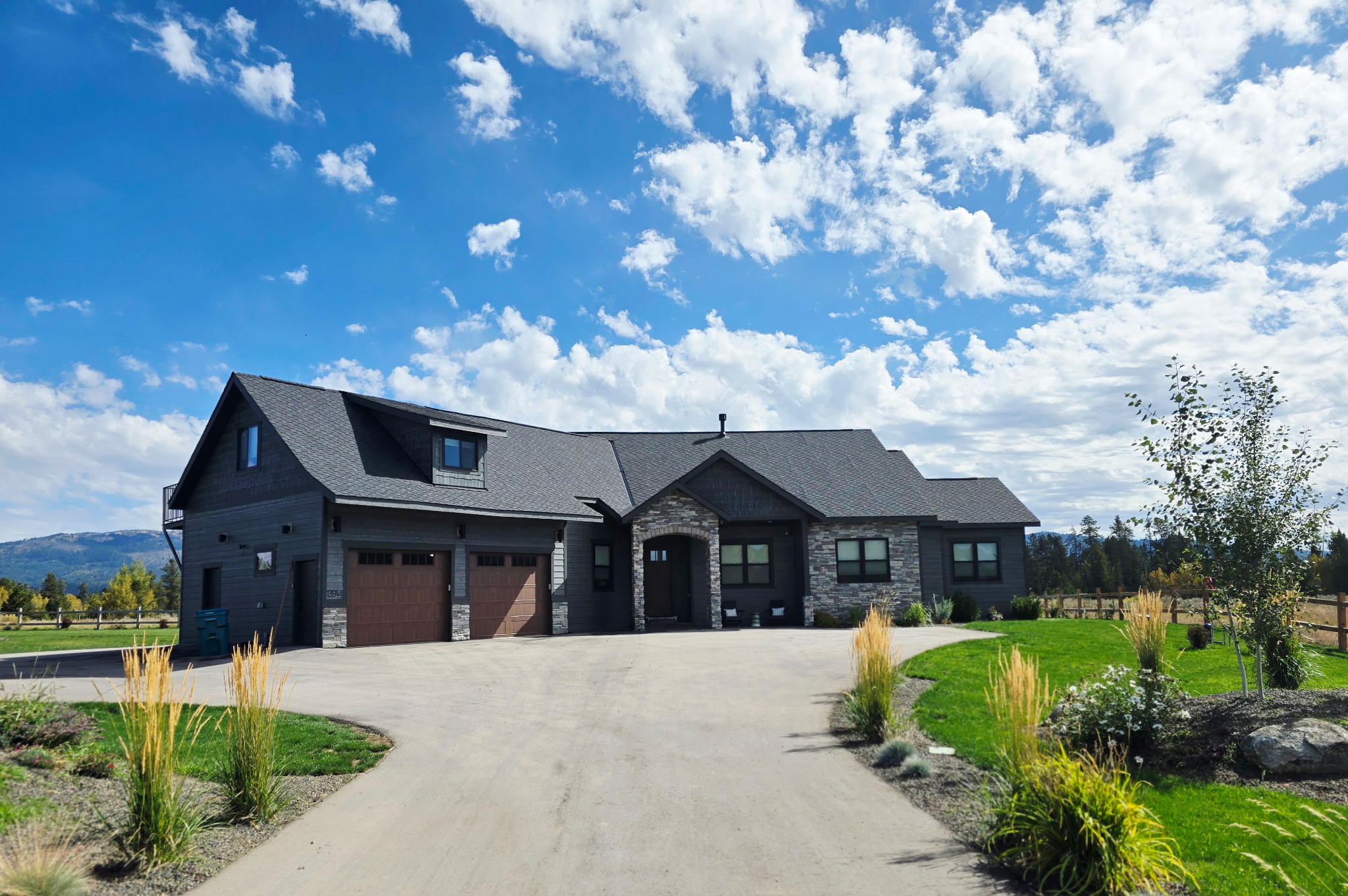 Spacious modern mountain home with scenic views and manicured grounds