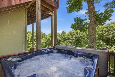 The private covered hot tub at Beech Mountain High is an experience all its own — sink in, let the jets work their magic, and take in serene treetop views that make every soak feel like pure mountain bliss.