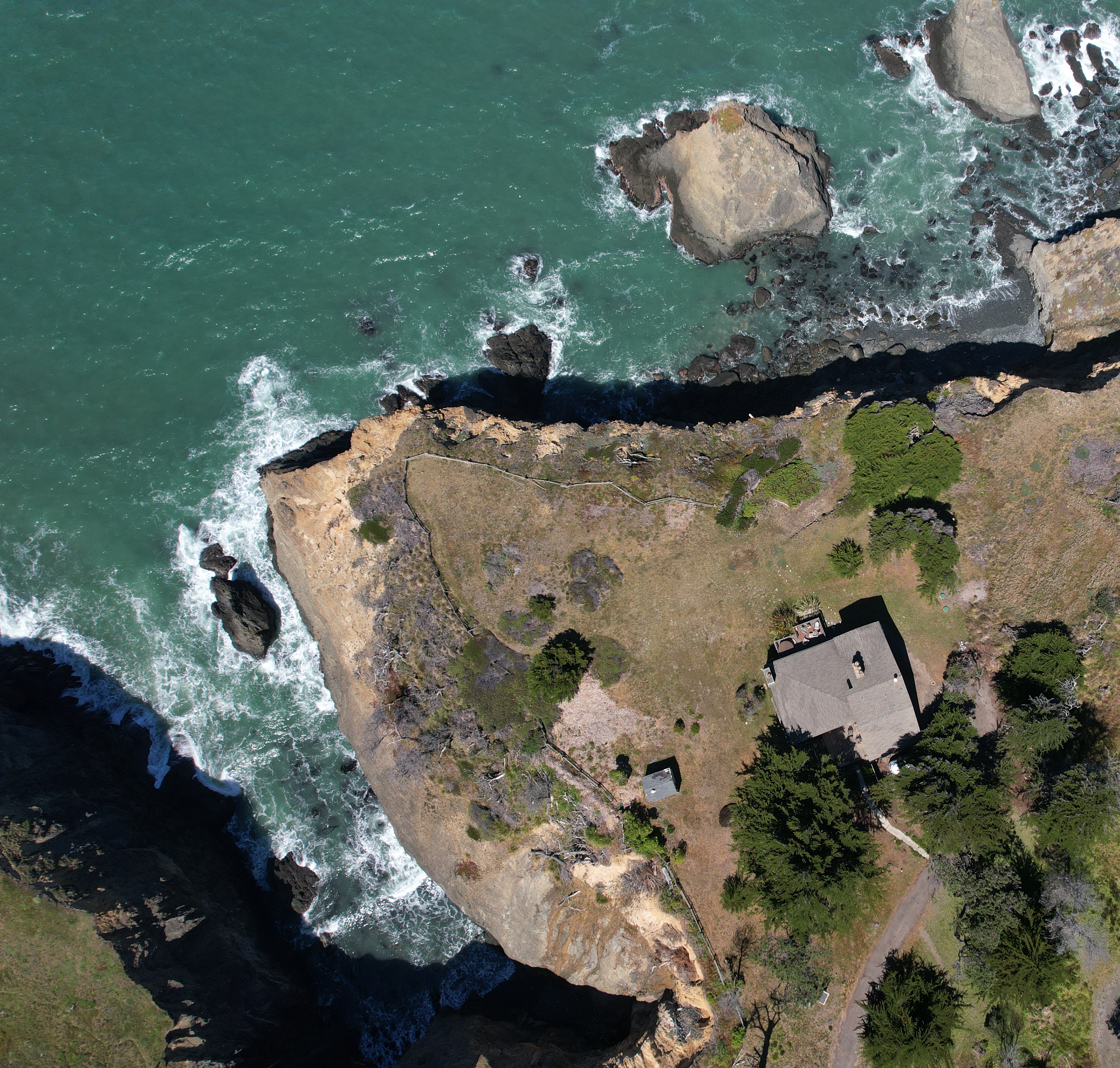 Dramatic cliffside retreat with sweeping oceanfront views
