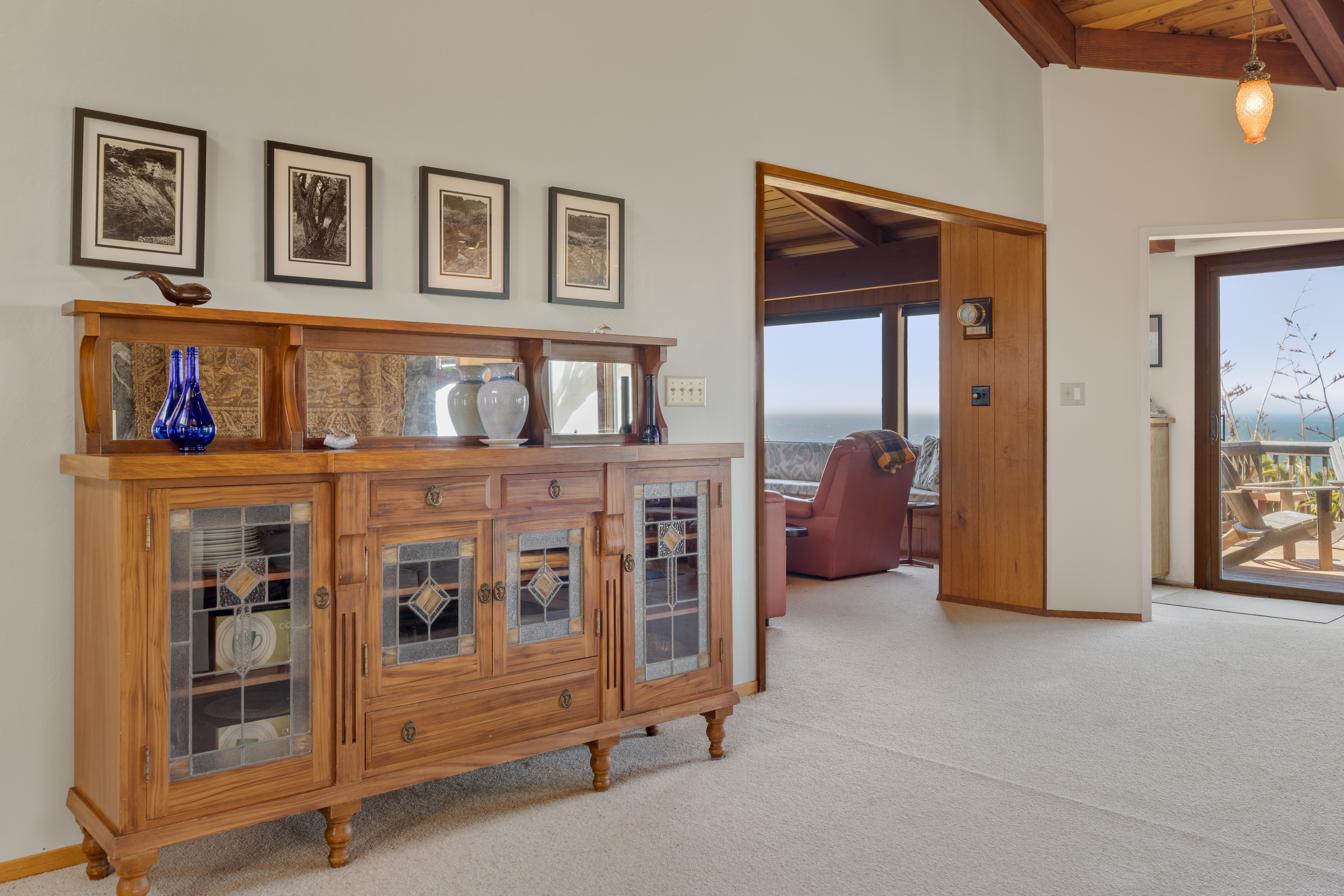 Warm wood details, ocean views, and deck access in a bright coastal retreat