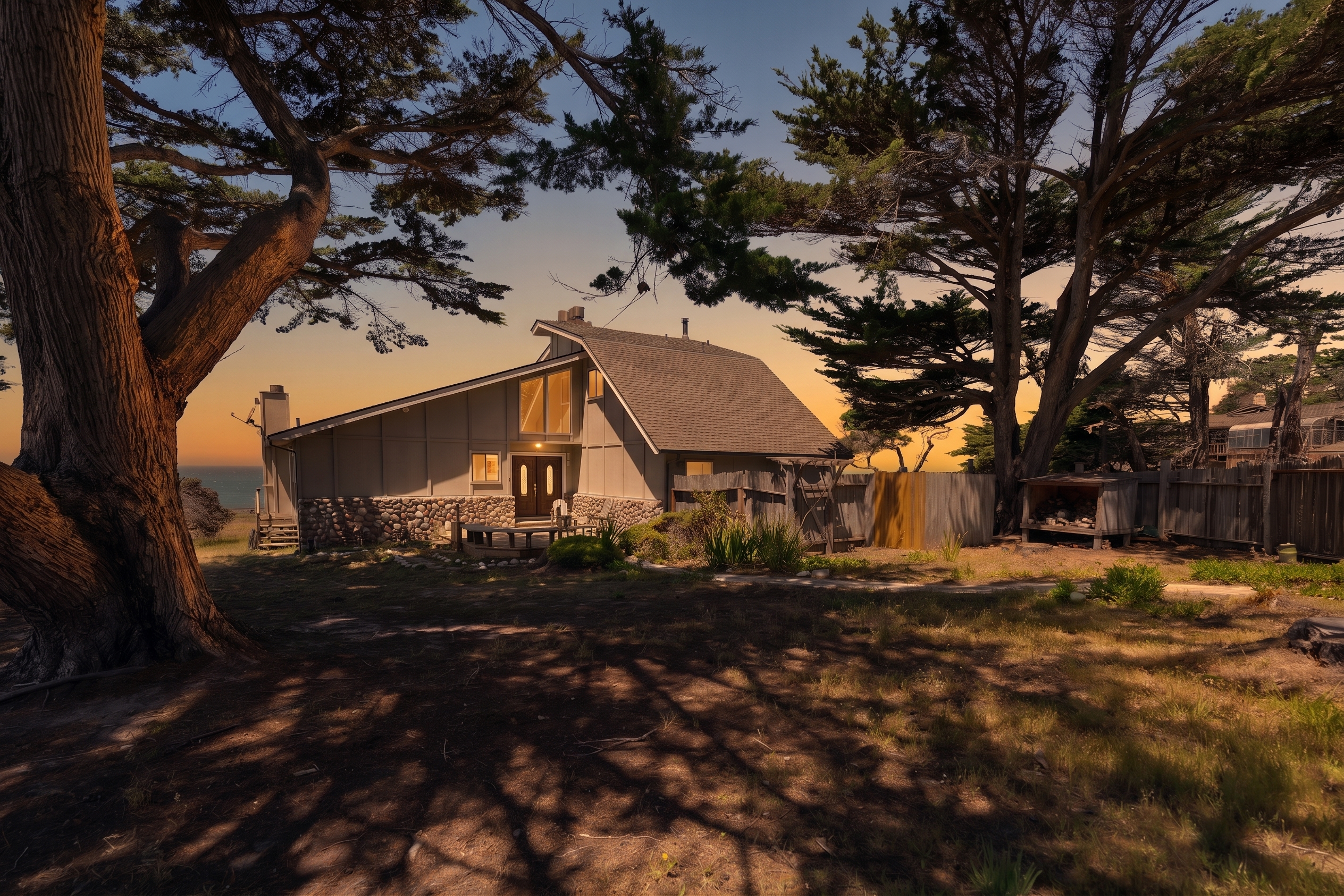 Charming sunset-lit A-frame retreat with trees, privacy, and ocean views