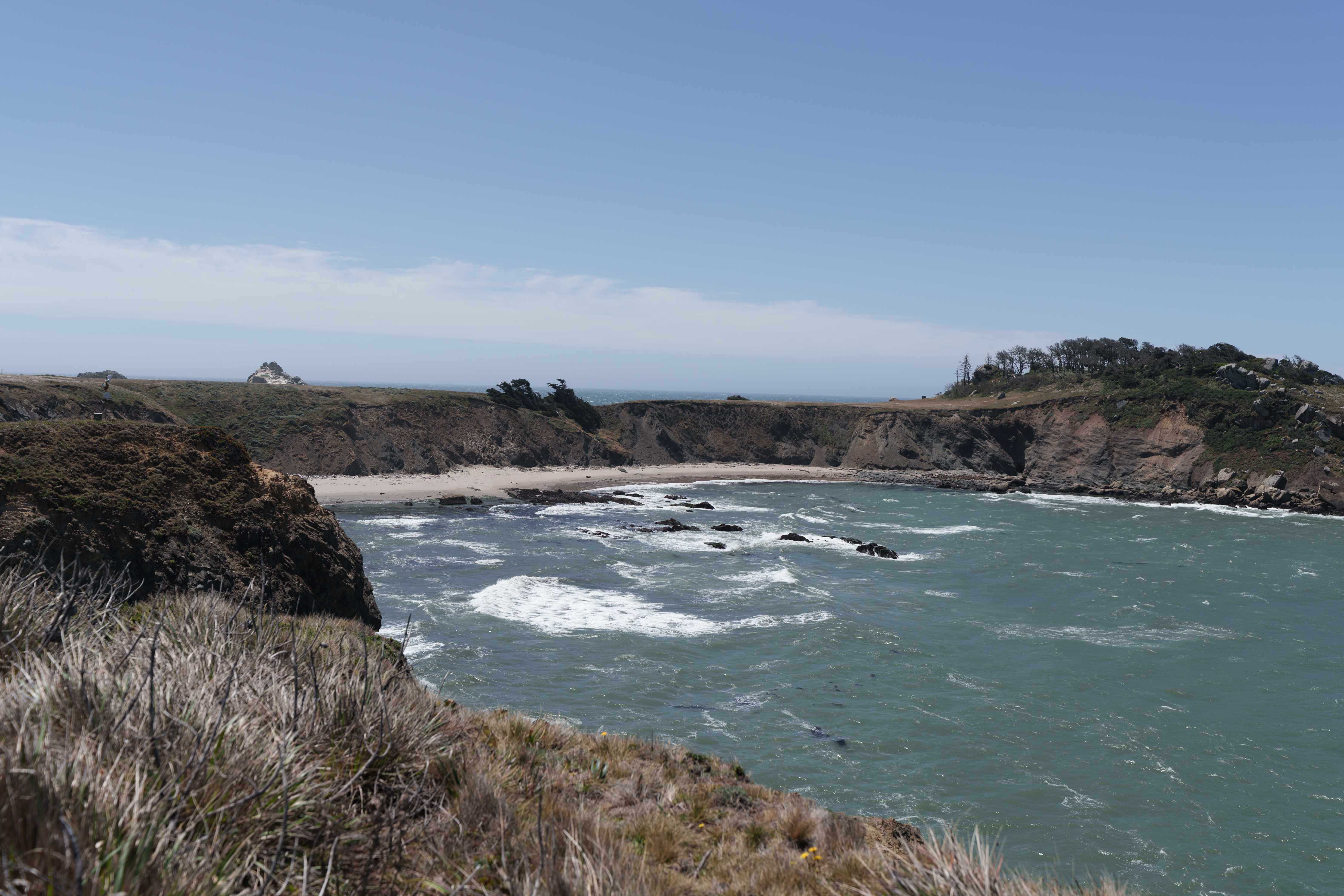 Stunning cliffside cove with sweeping ocean views and a secluded beach