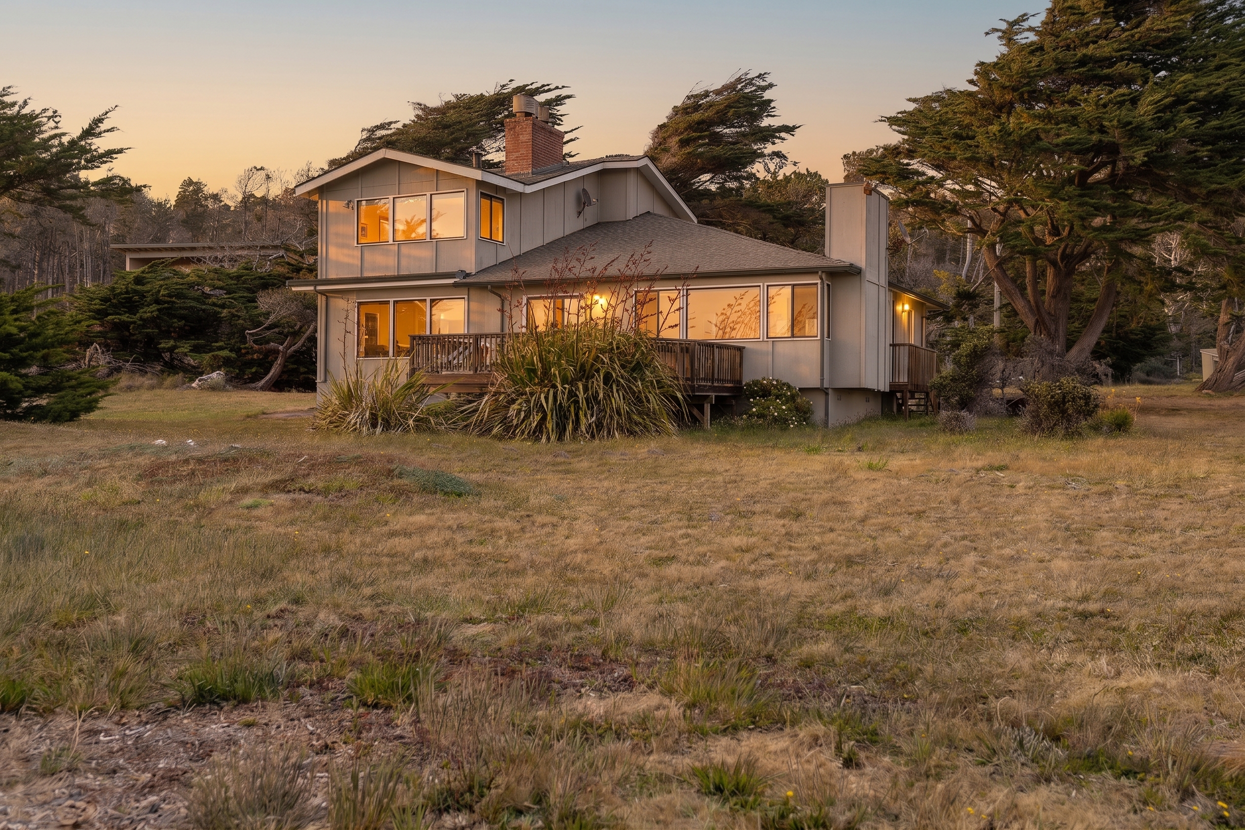 Warm, inviting home on a private lot surrounded by trees at sunset