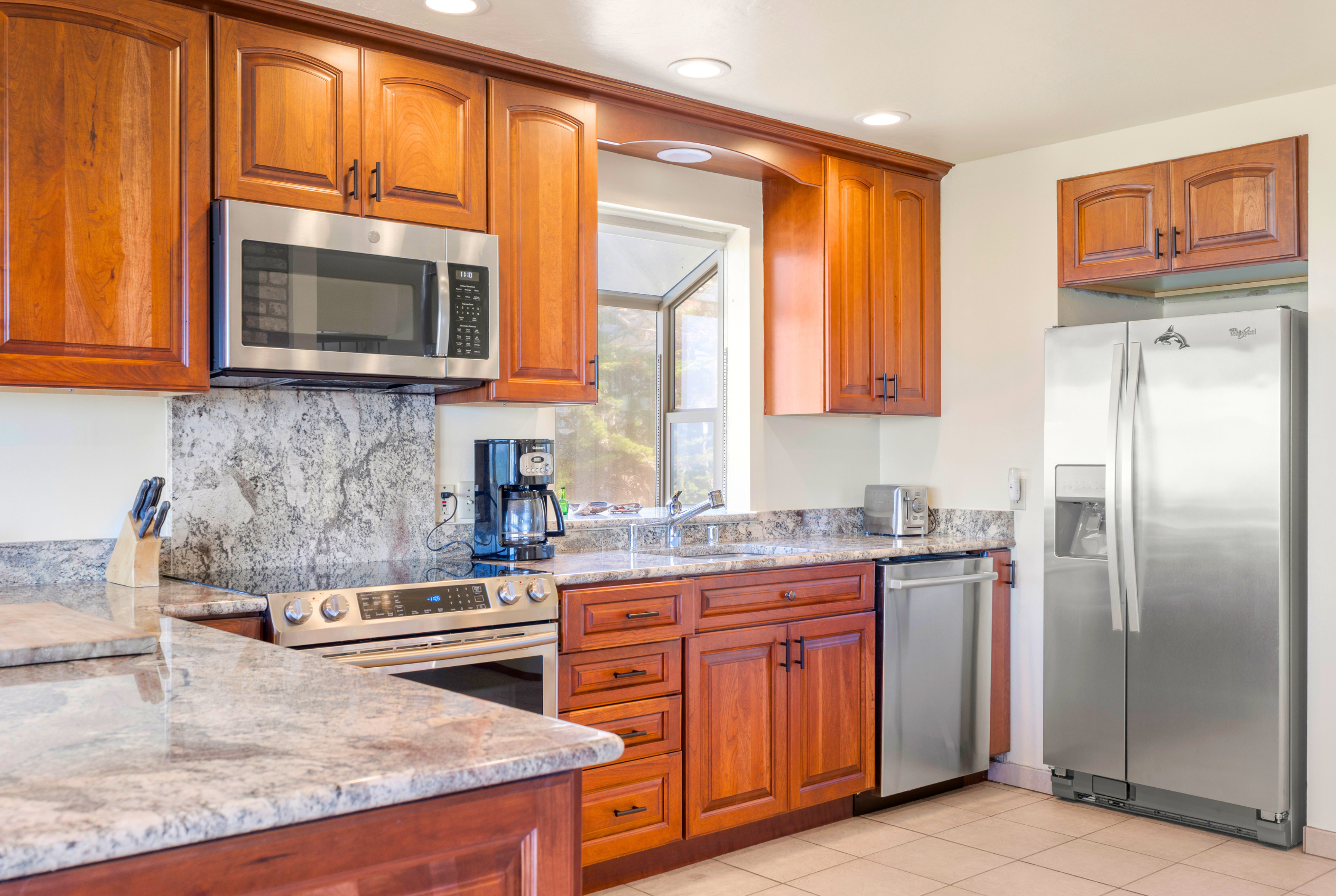 Bright kitchen with stainless appliances and generous counter space