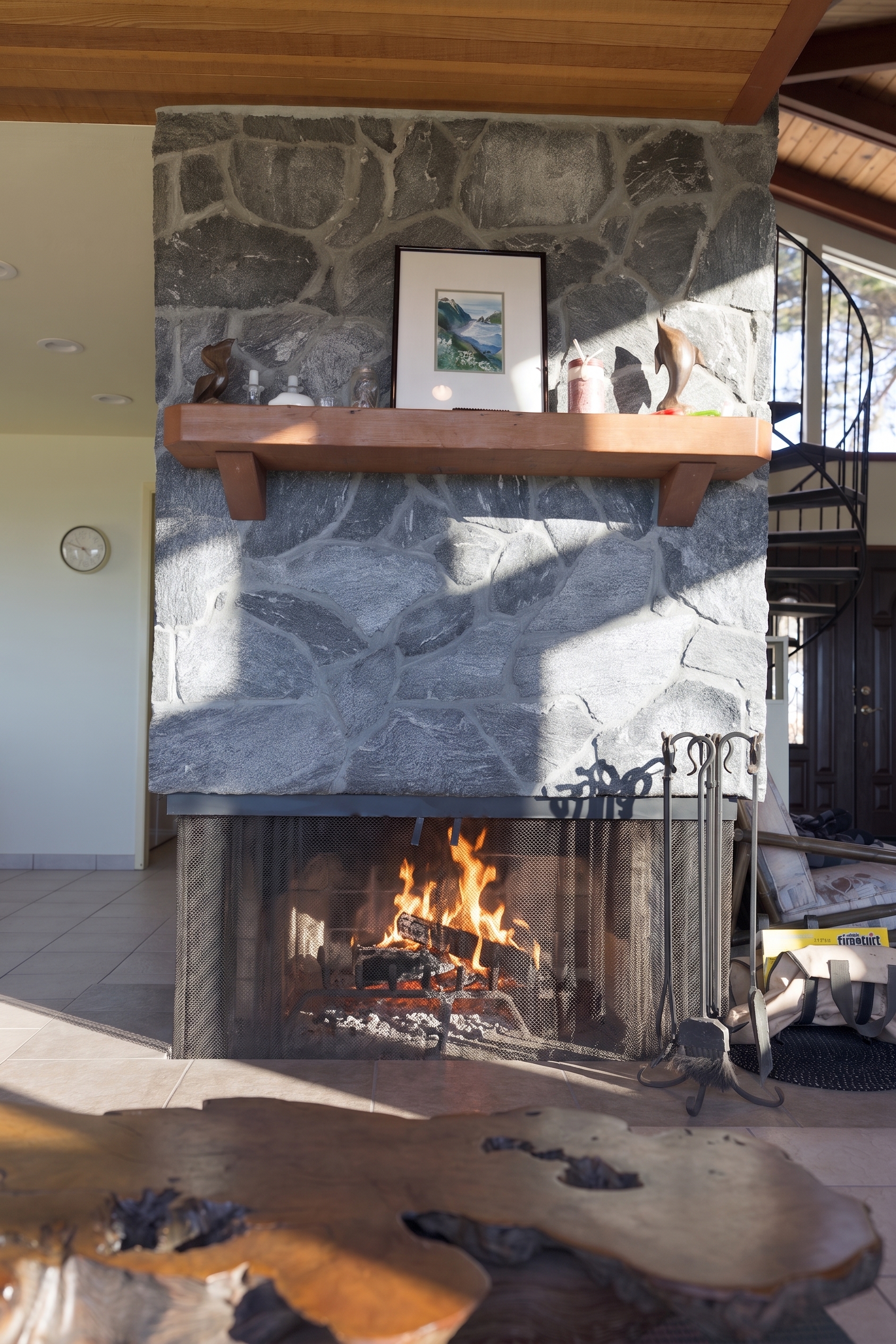 Cozy stone fireplace with rustic charm and inviting natural light
