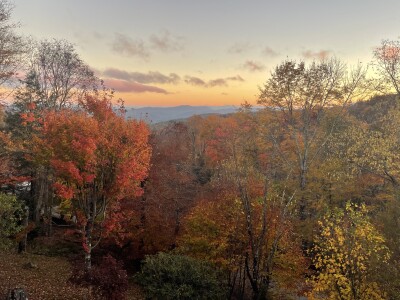 Stunning sunset mountain views surrounded by vibrant fall foliage