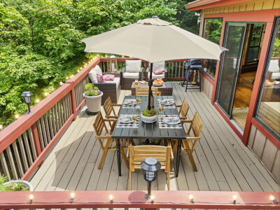 Dine, lounge, and grill on the private wooded deck — outdoor dining, comfortable seating, and a grill come together with peaceful forest surroundings to make every outdoor moment unforgettable.