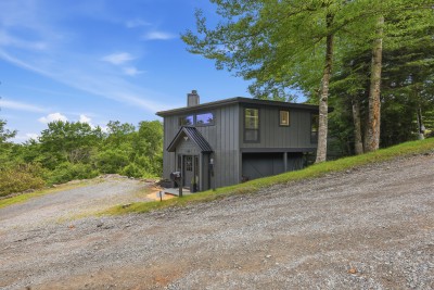 Escape to This Modern Hillside Cabin, Tucked Away Amid Towering Trees for Total Privacy! Enjoy Sleek Contemporary Design, Peaceful Wooded Surroundings, and a Spacious Driveway with Plenty of Room for Multiple Vehicles — Mountain Living at Its Finest!