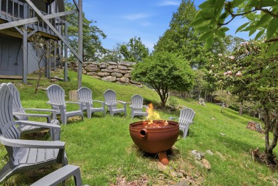 Settle into the Adirondack chairs around the hillside fire pit and let the crackling flames and lush wooded views set the scene for relaxed evenings and great conversation at Beech Mountain Place.