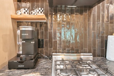 Cook up something delicious in this stylish kitchen, complete with a gas cooktop and a dedicated Keurig station to fuel your mornings before mountain adventures.