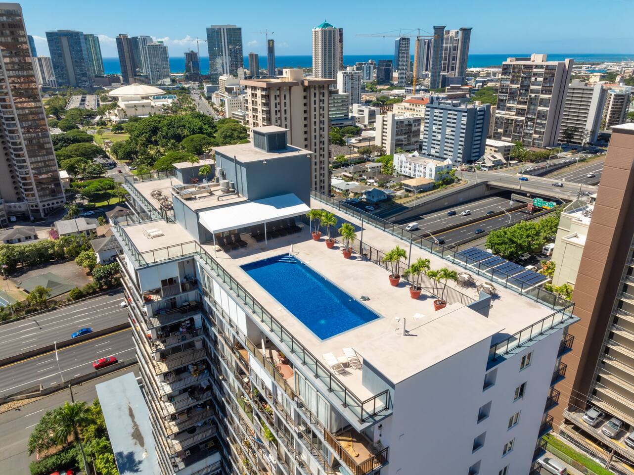 Unwind at our rooftop pool with panoramic views of mountains, city, and ocean.