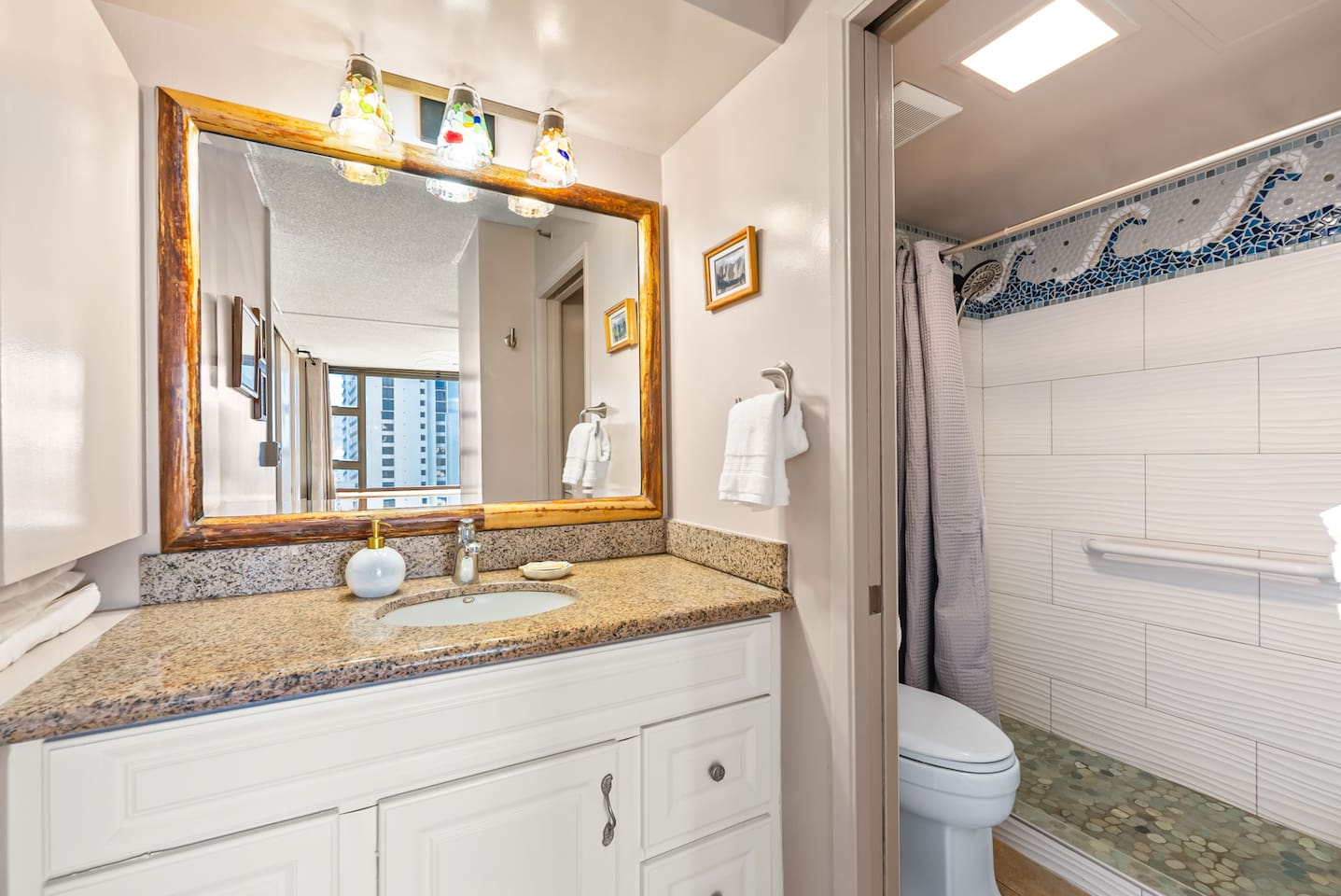 Start your day refreshed in the beautifully designed bathroom, complete with an updated shower and plenty of storage.