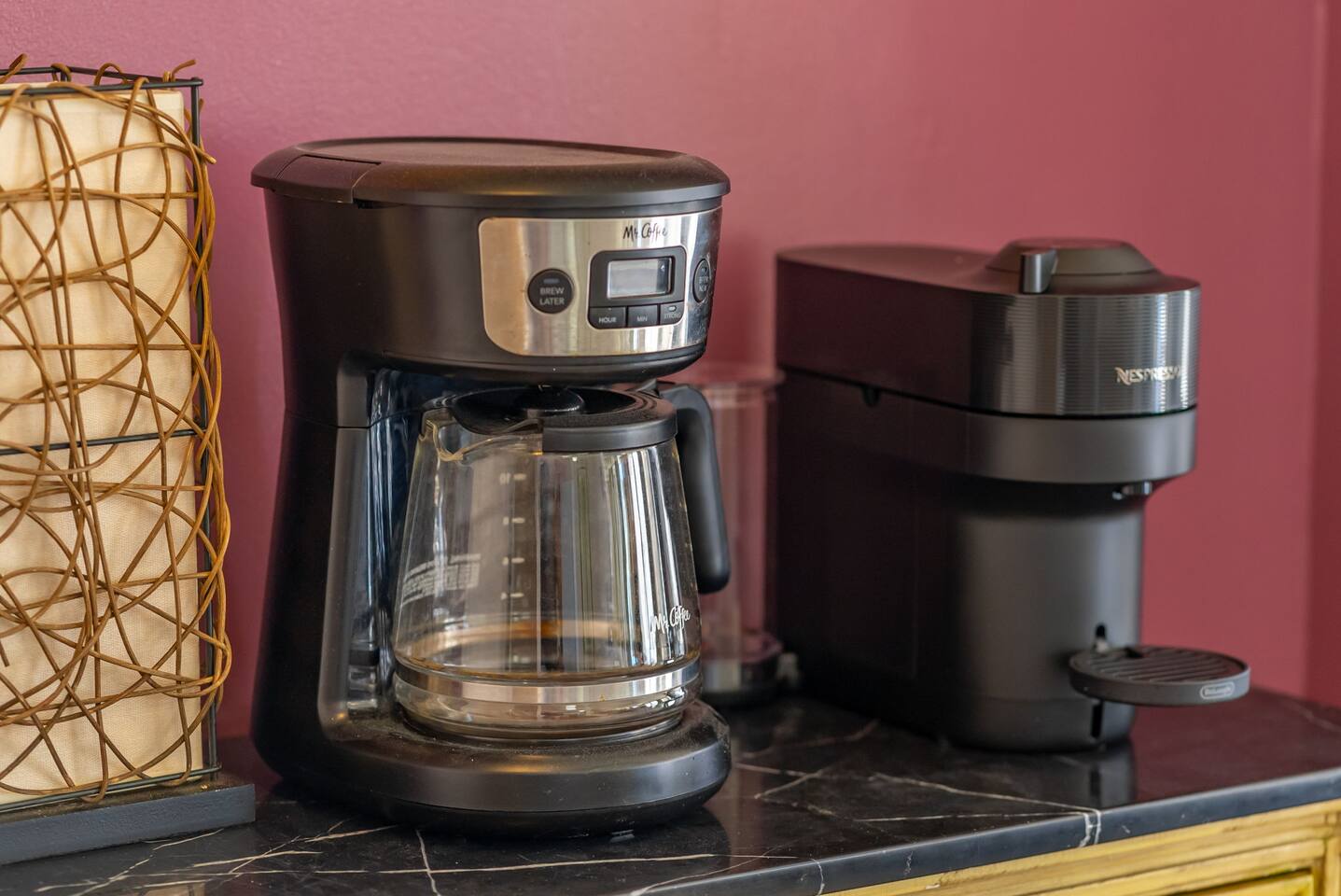 Start your day right with a stocked coffee bar-complete with Nespresso pods and a drip coffee maker.