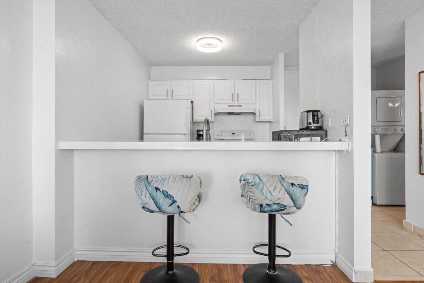Featuring open bar seating, this kitchen is perfect for casual dining or keeping company while you cook.