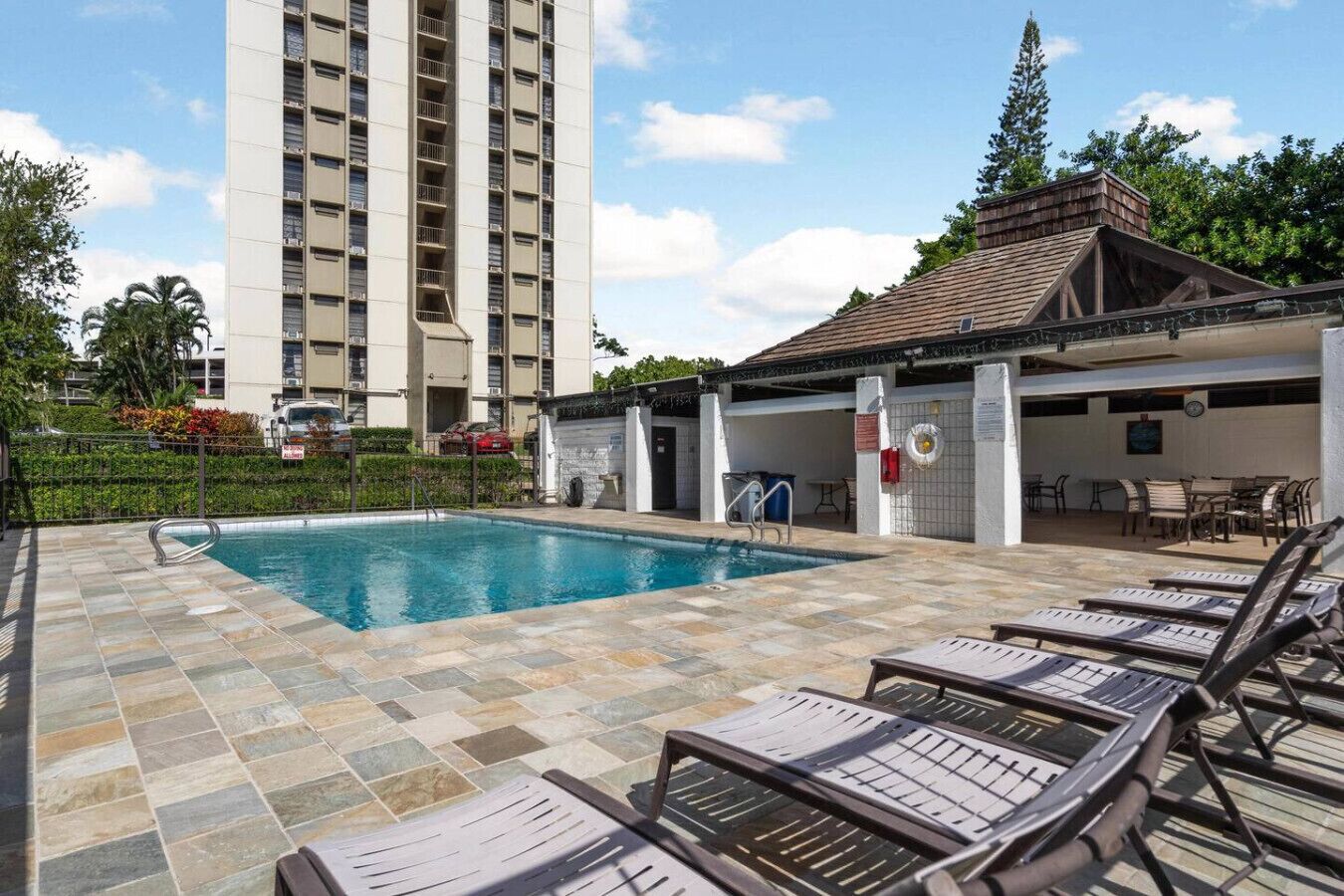 Relax, recharge, and soak up the rays at the building`s private pool.