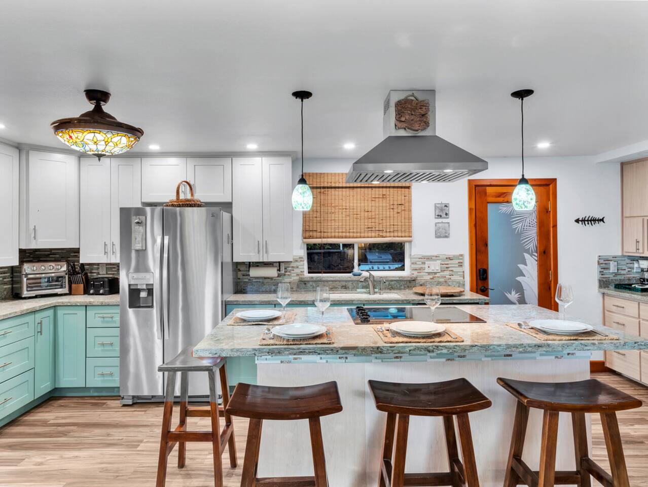 The large island offers ample space for cooking, socializing, and enjoying your time together in the kitchen.