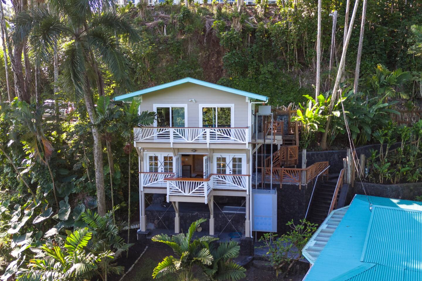 The garage and separate bungalow suite are located above the main house and come with incredible sunrise views
