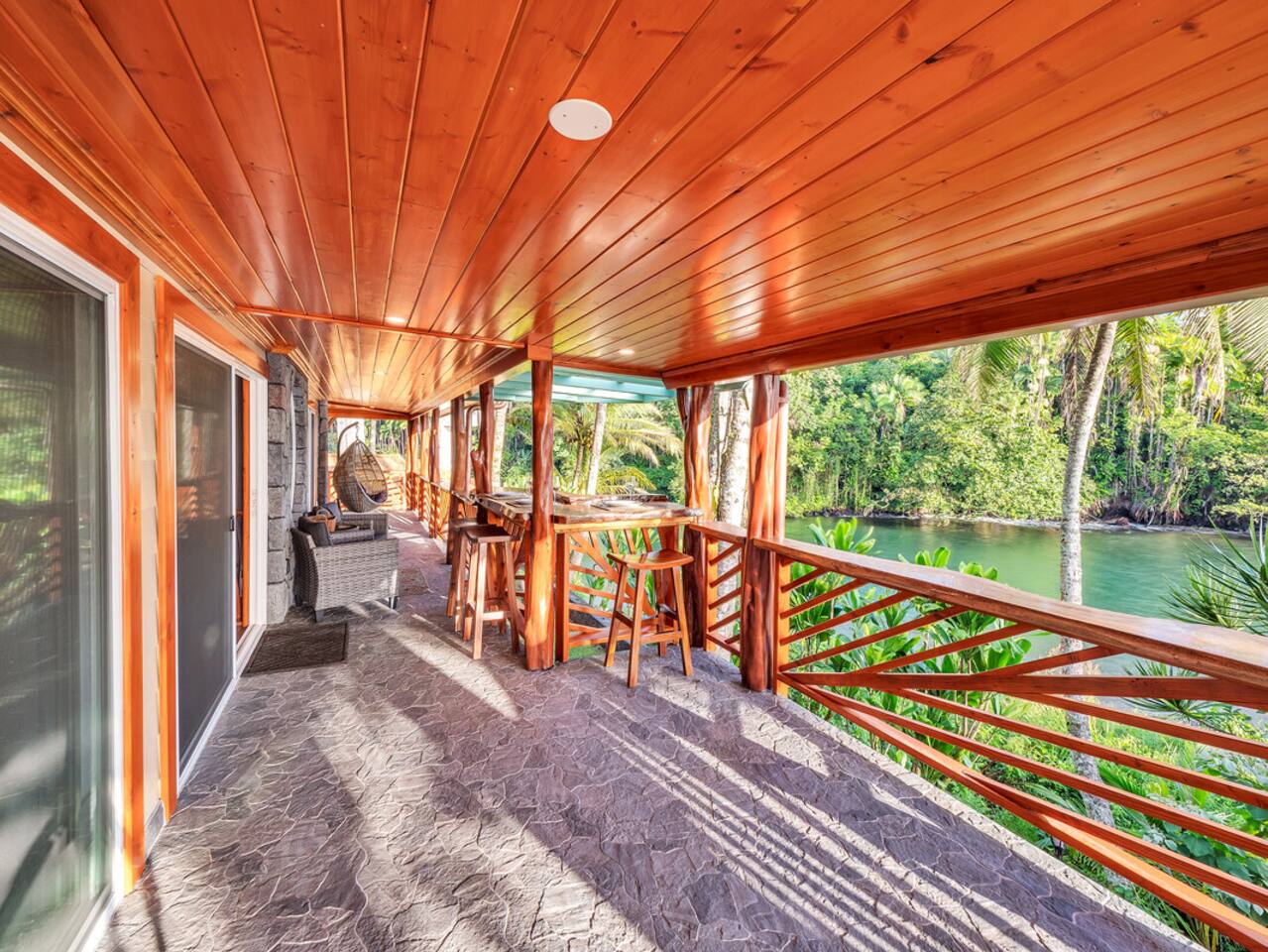 Enjoy a meal or a drink at the exterior bar, where you can savor every bite while overlooking both the serene river and the expansive ocean