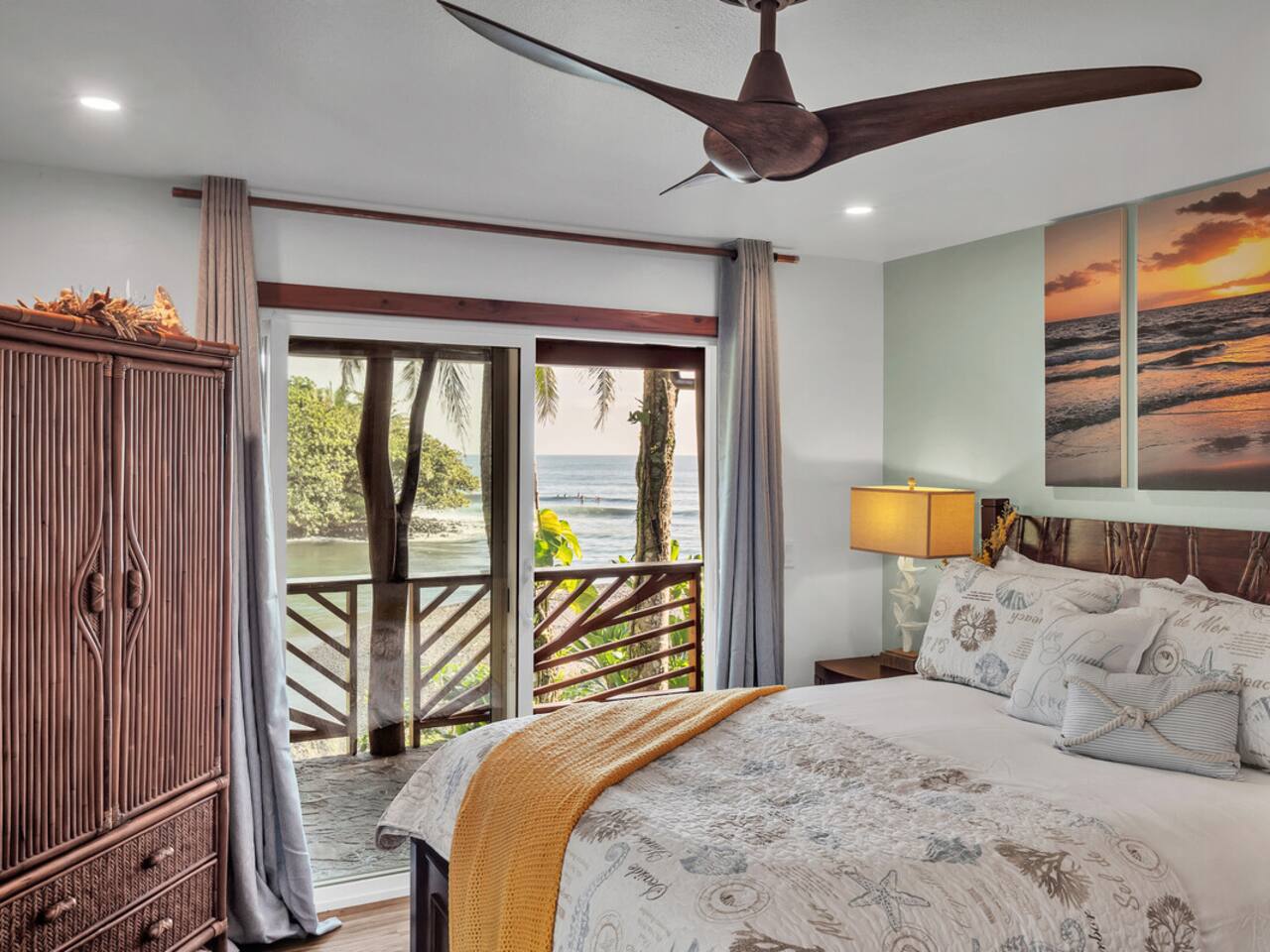 Fall asleep to the sound of waves crashing just outside your window in this tranquil bedroom with stunning views.