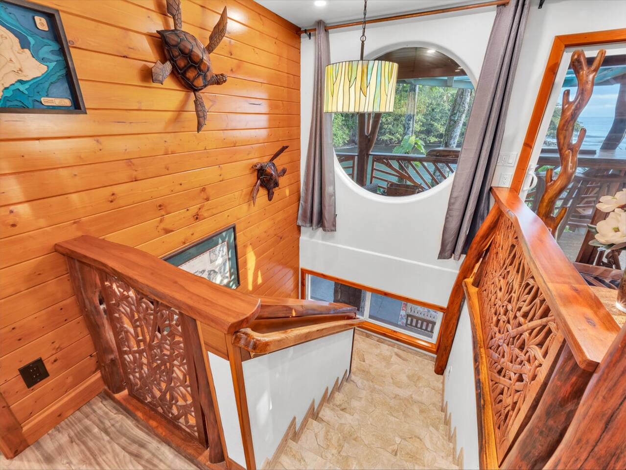 Admire the Hawaiian touches and craftmanship as you descend to the lower level of the house