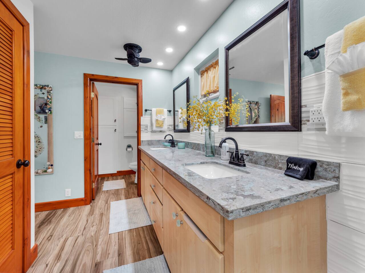 The master bathroom has a separate toilet room for added privacy