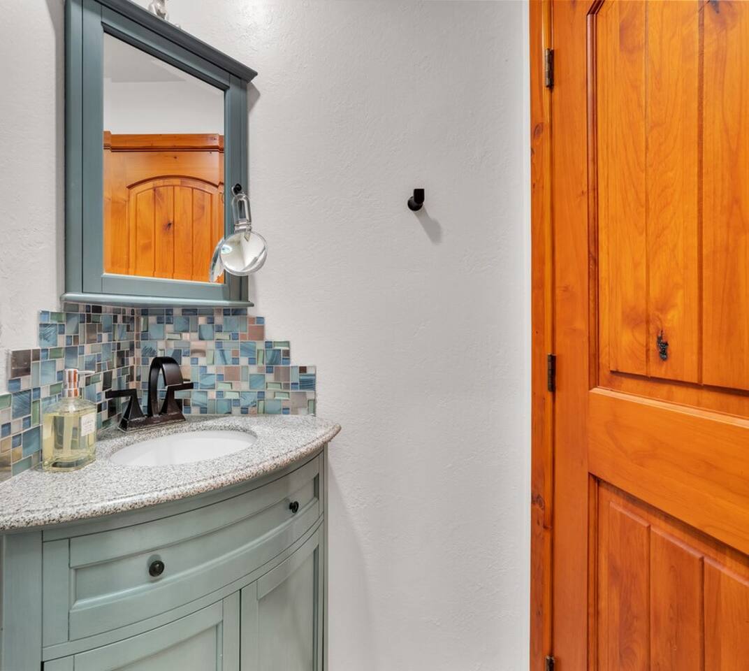 The downstairs half bath offers extra bathroom space to accommodate the whole group