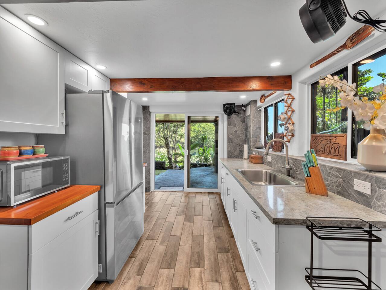 The downstairs food prep area is ideal for cookouts and outdoor meals, offering a convenient space to prepare dishes while you dine al fresco with river and ocean views.