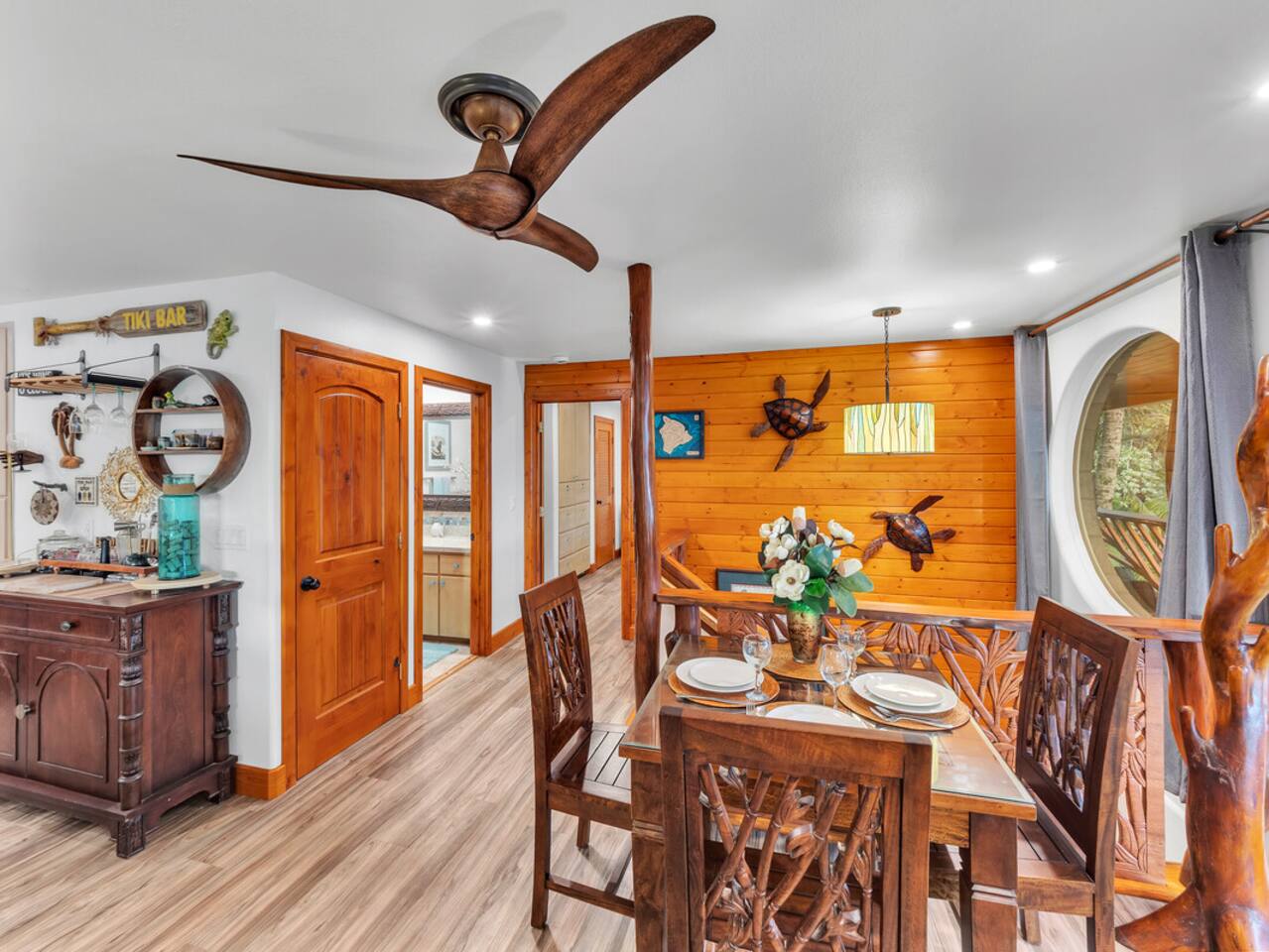 Handcrafted wood finishes and ocean breezes make this living room the heart of the home.
