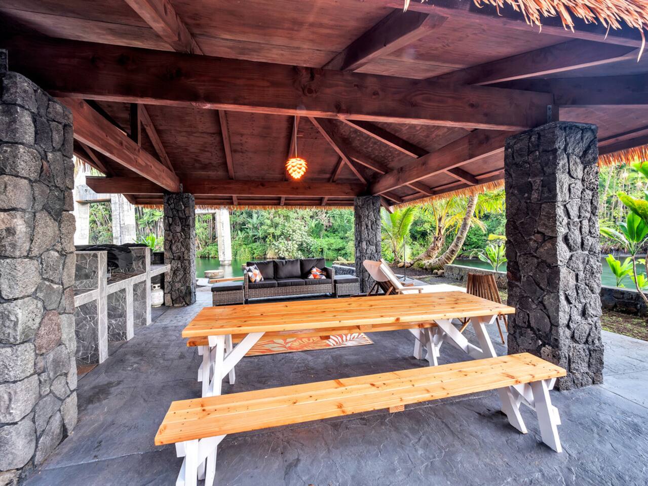 Gather your group for outdoor dining at the Honoli'i Halau, offering panoramic views of the ocean and river.
