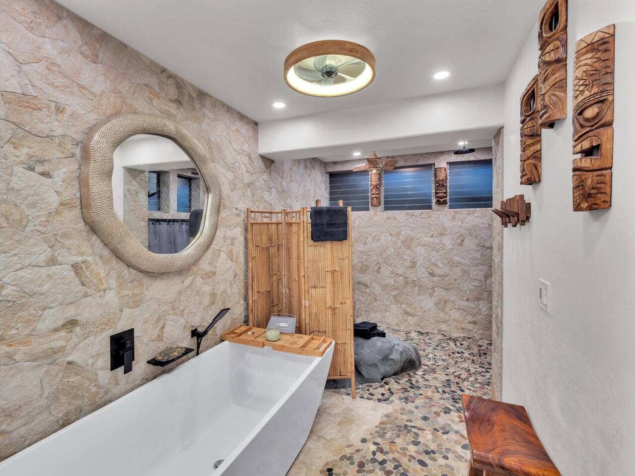 The hand-hewn stone elements in the bathroom make you feel like you’re bathing in nature’s own spa.