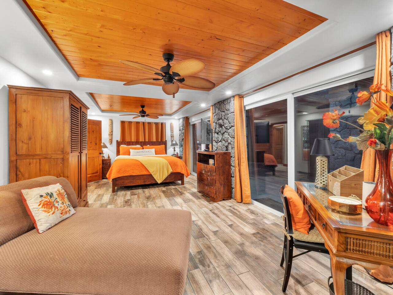 A comfortable, spacious downstairs bedroom with easy access to the lanai for taking in the view.