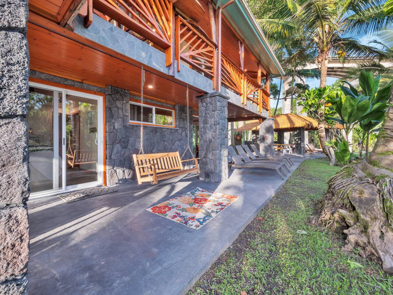 The grounds are a perfect blend of lush greenery and relaxing spaces, with the wrap-around lanai offering the perfect setting for both private moments and group gatherings.