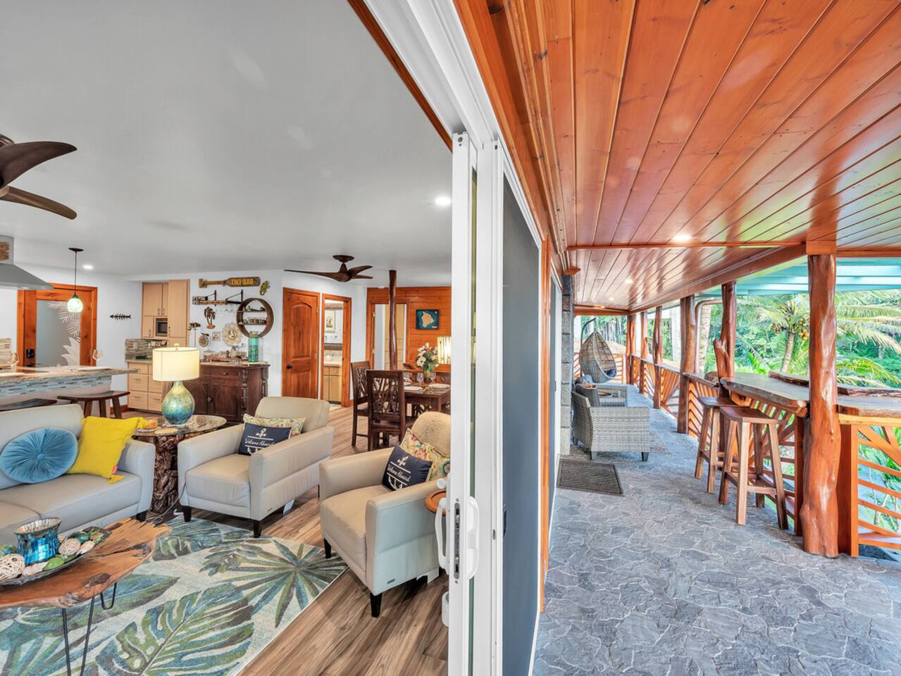 Indoor/outdoor living at its finest—relax with ocean views from every corner of this stylish living room.